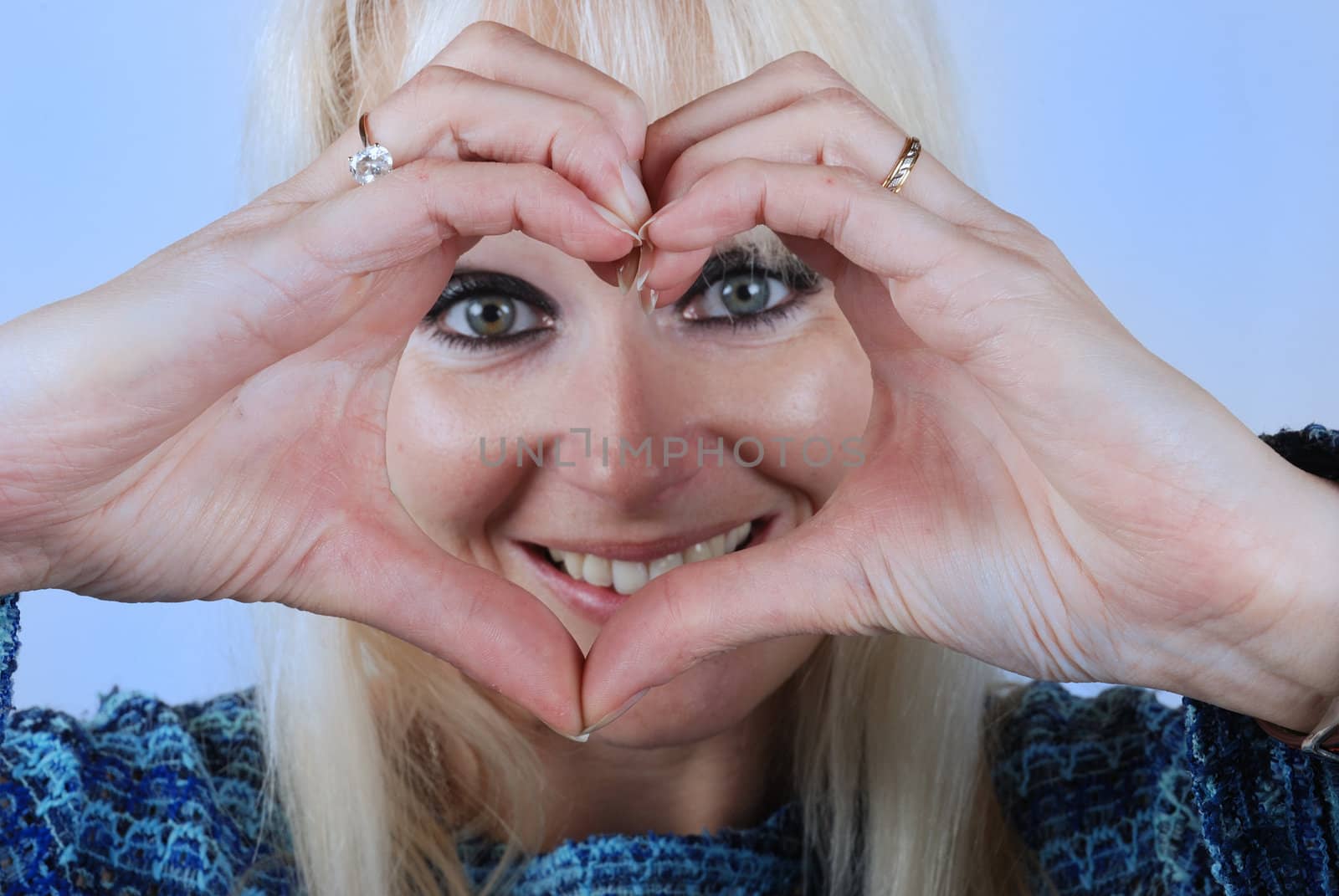 Woman making heart shape with her hands