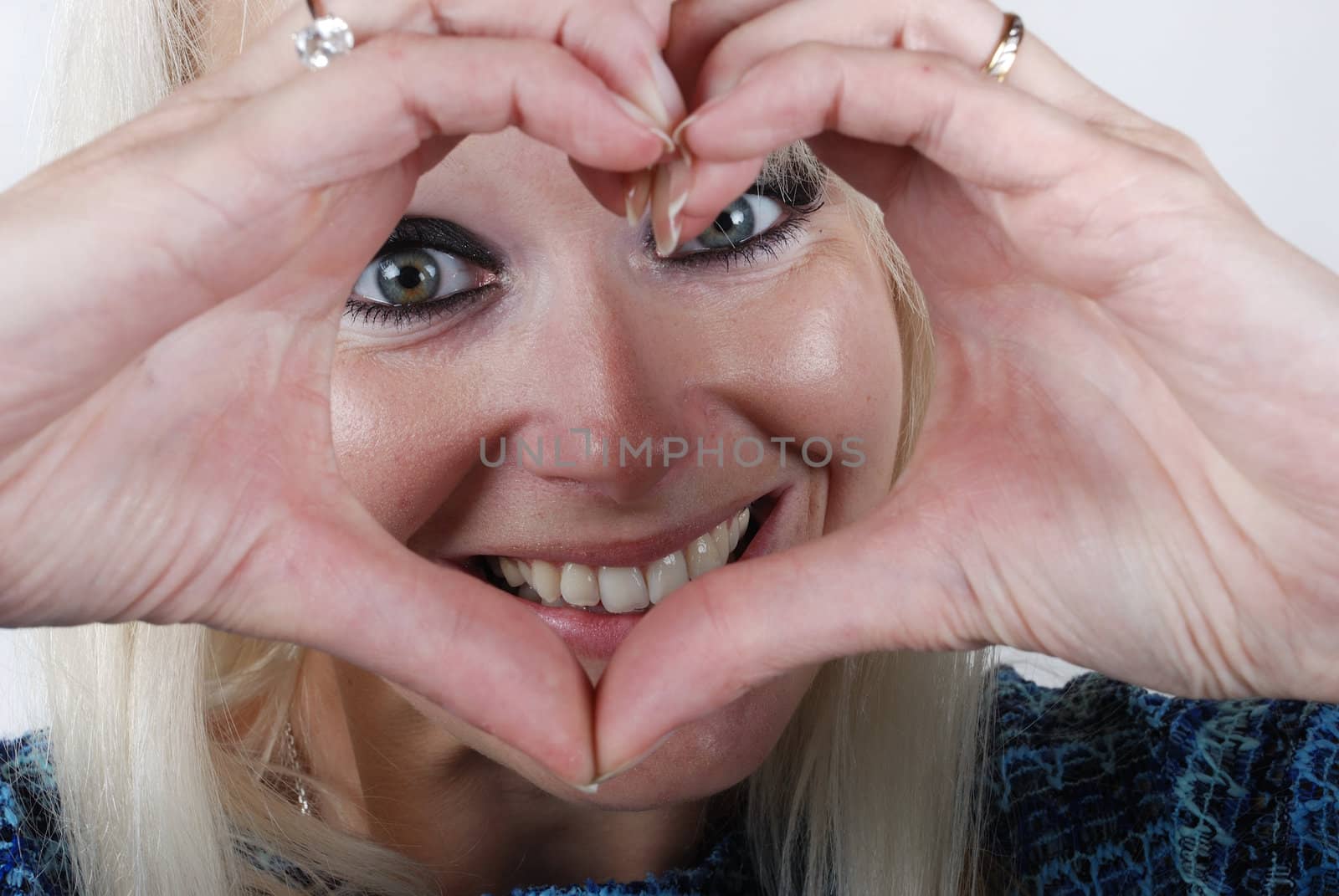 Woman making heart shape with her hands