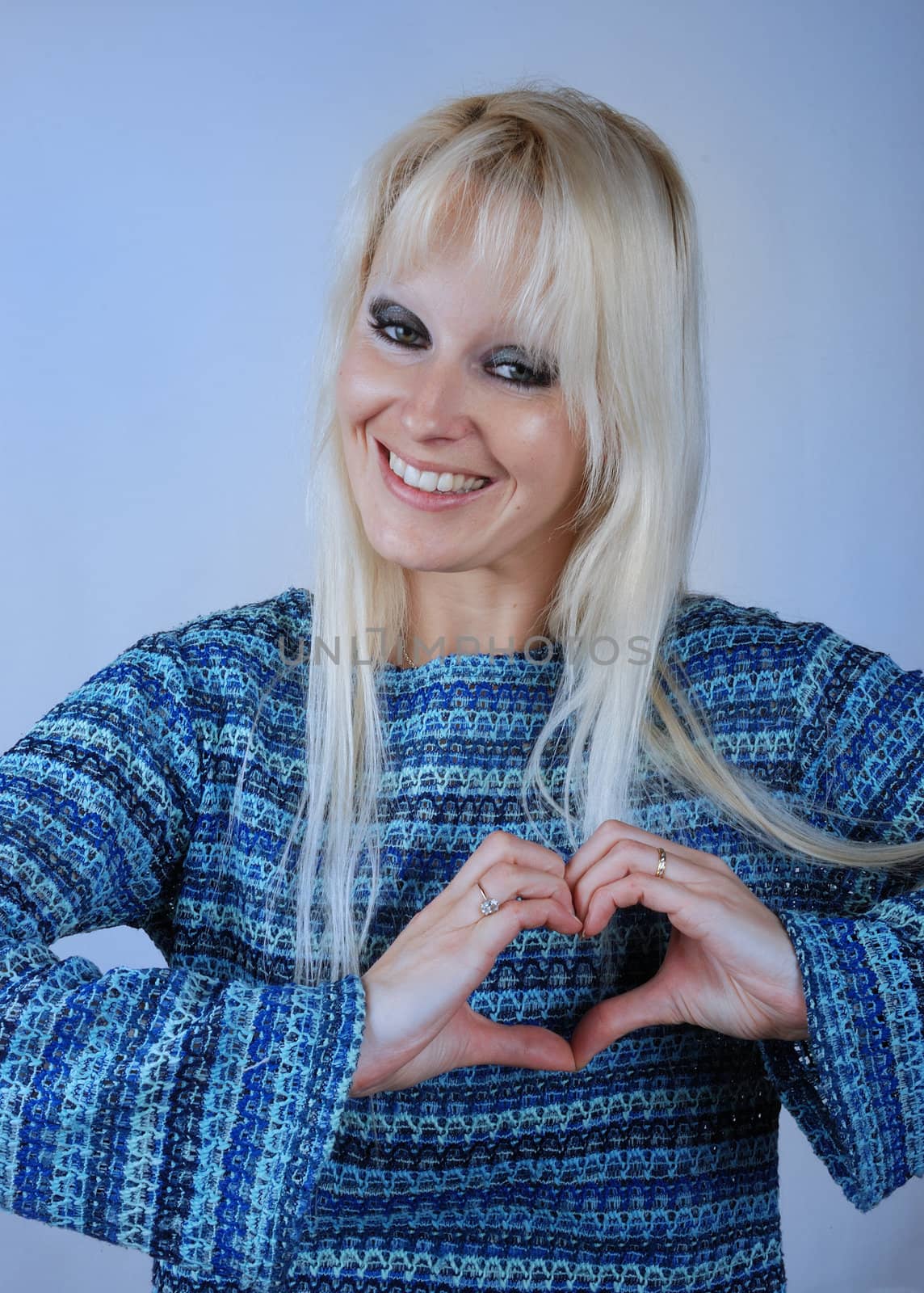 Woman making heart shape with her hands