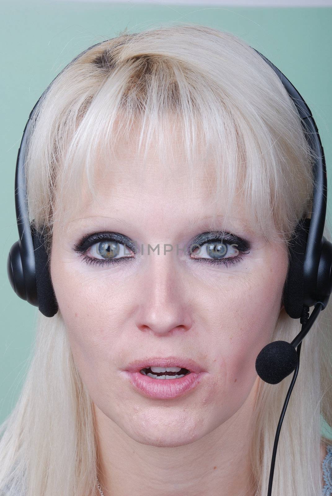 Portrait of young woman with headset