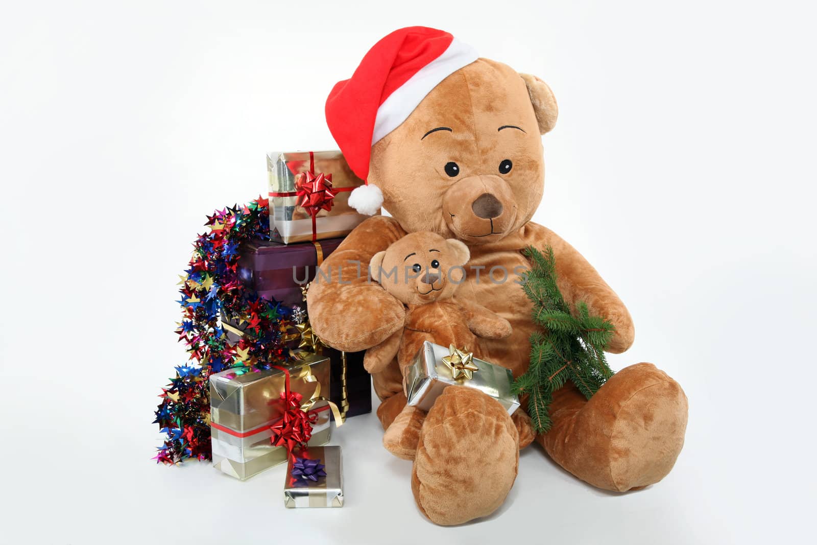 Huge teddy bear and Christmas gifts on white background