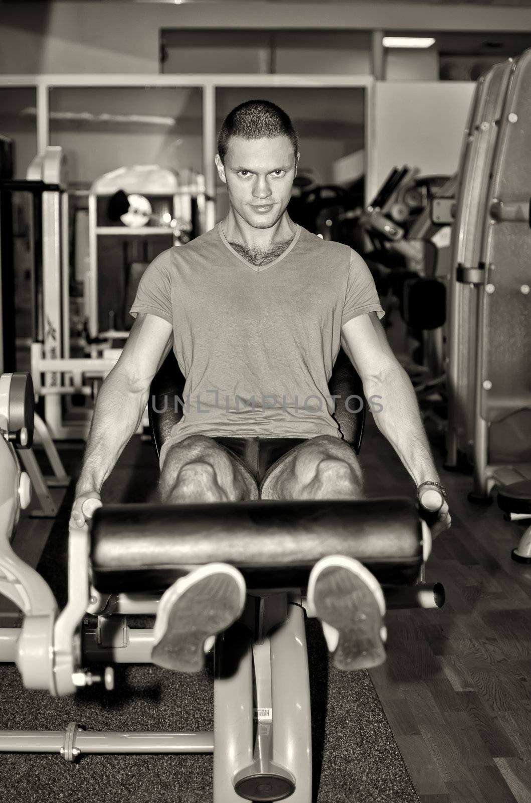 Man doing athlete exercise in fitness club