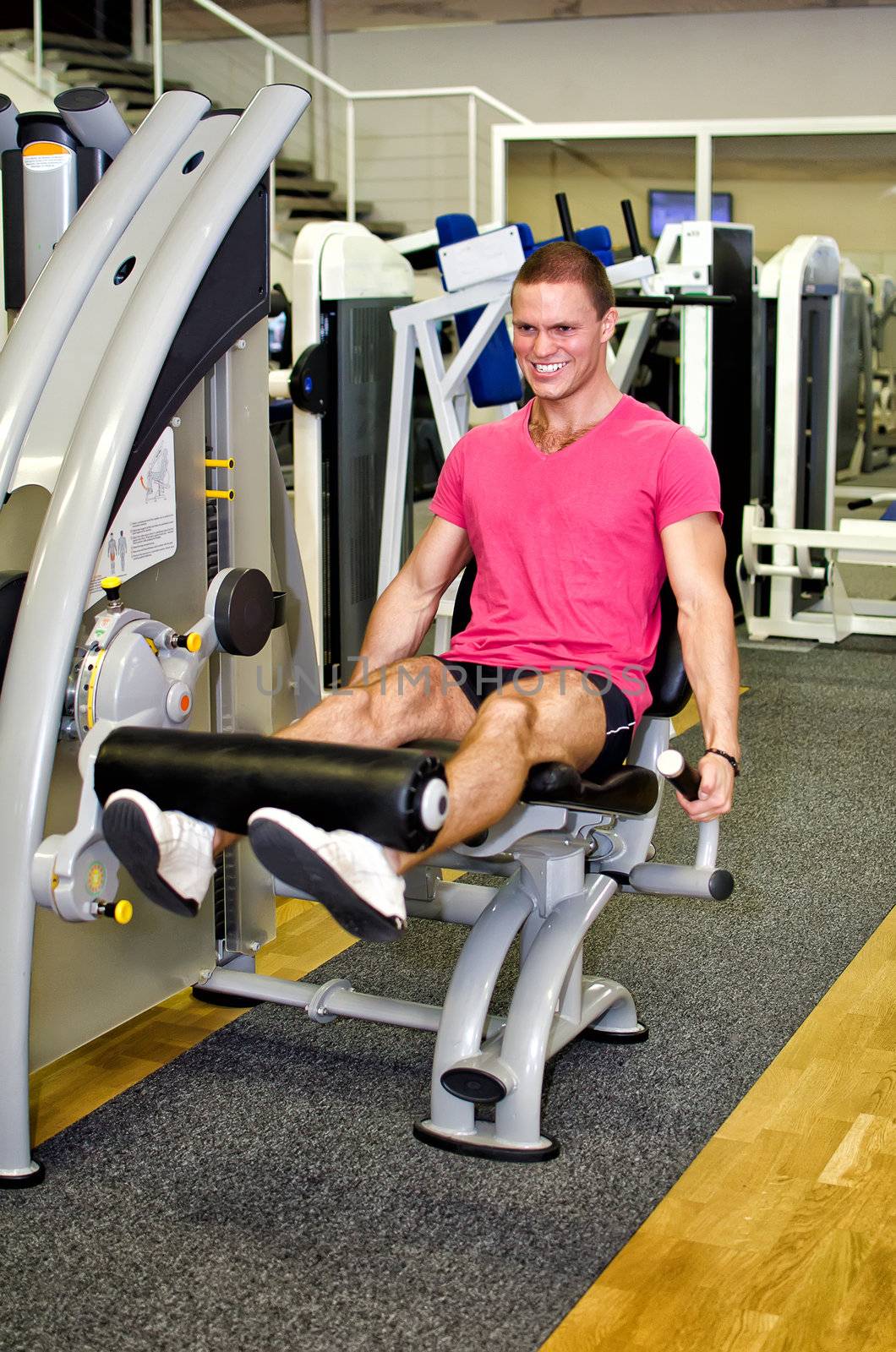 Man doing athlete exercise in fitness club