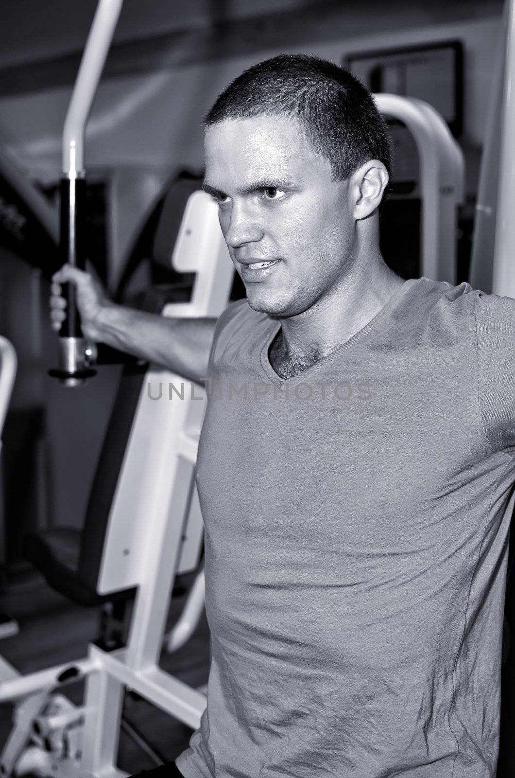 Man doing athlete exercise in fitness club