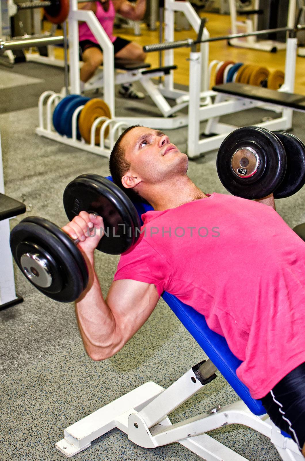 Man doing athlete exercise in fitness club