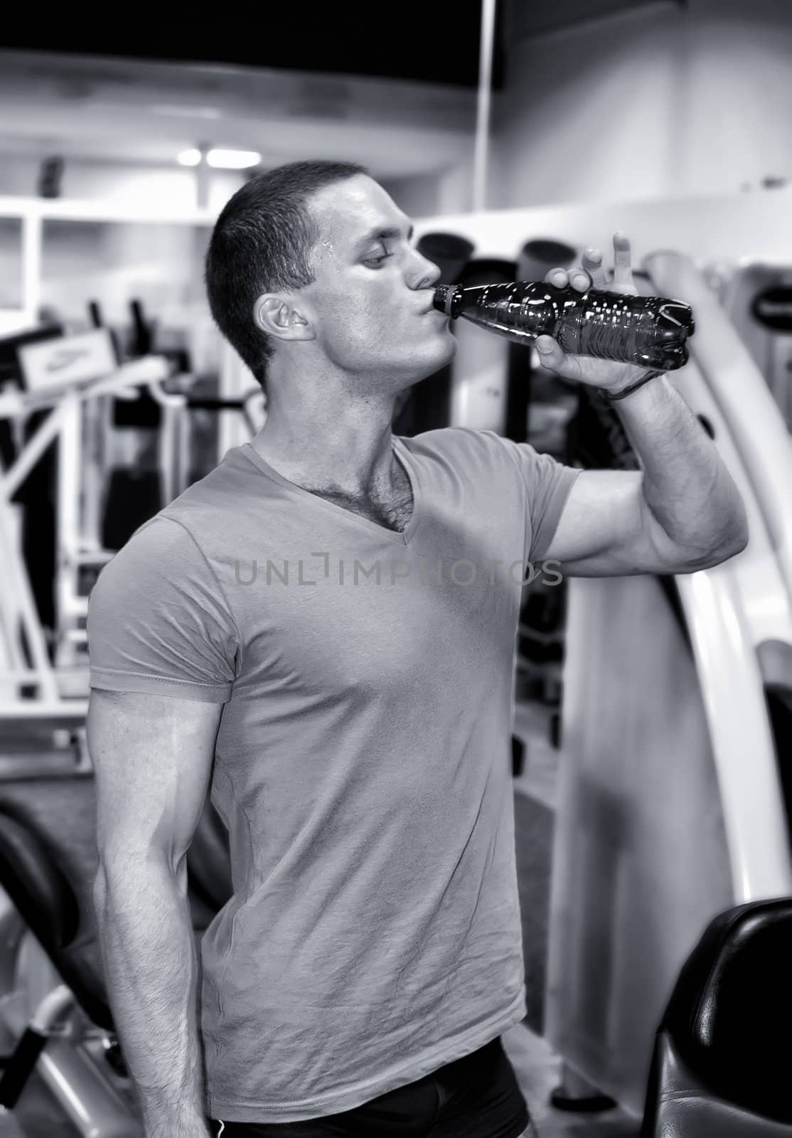 Man doing athlete exercise in fitness club