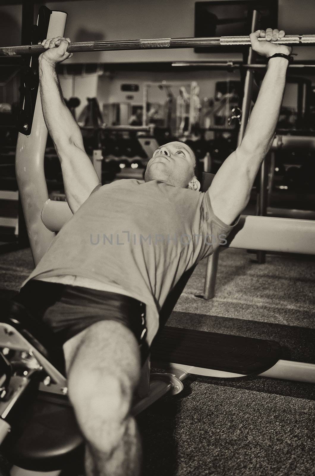 Man doing athlete exercise in fitness club