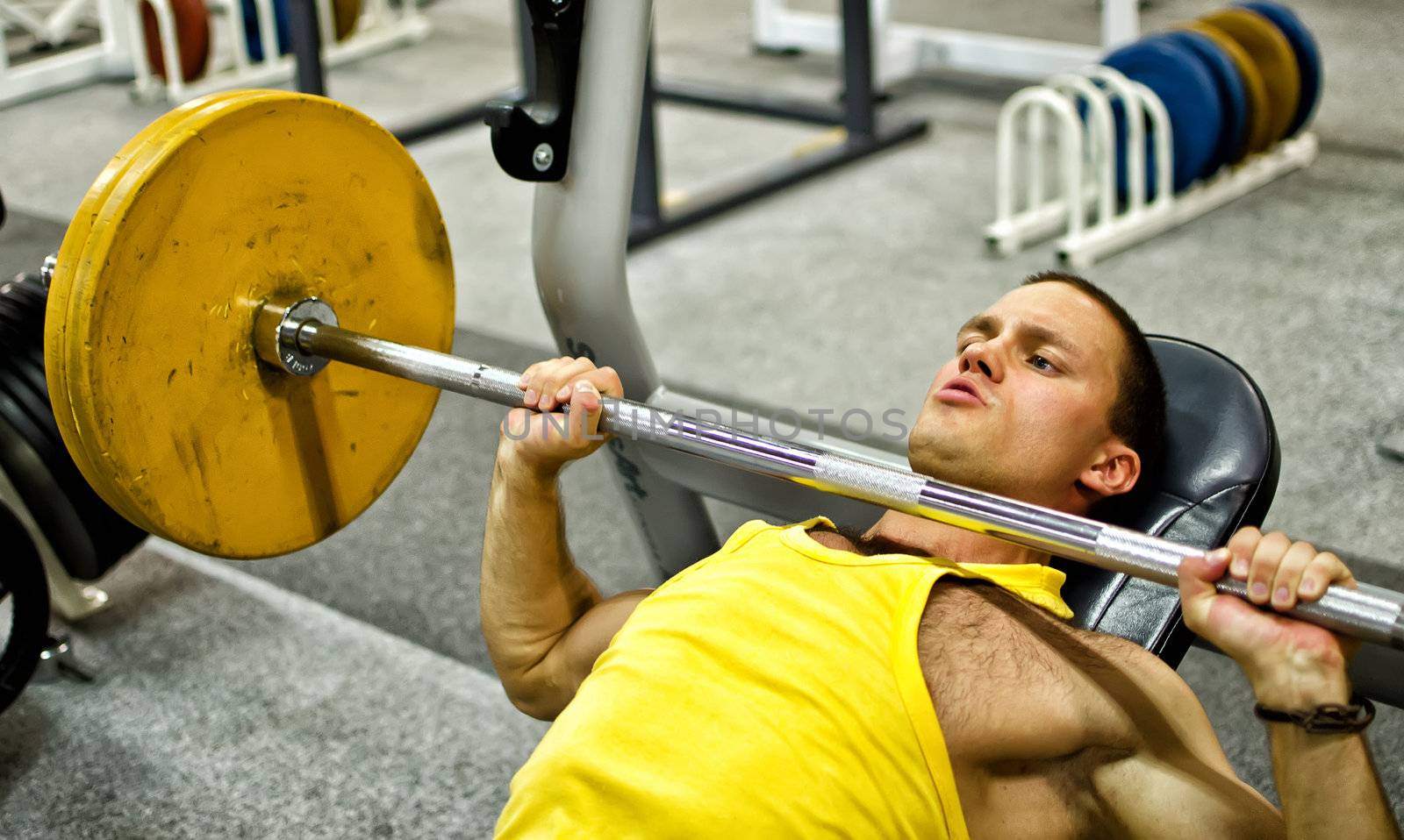 Man doing athlete exercise in fitness club