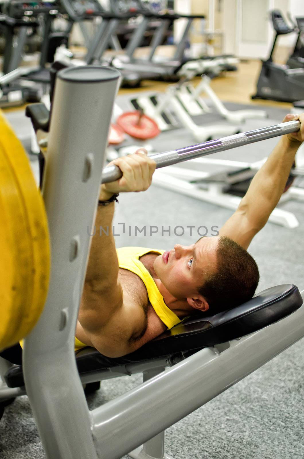 Man doing athlete exercise in fitness club