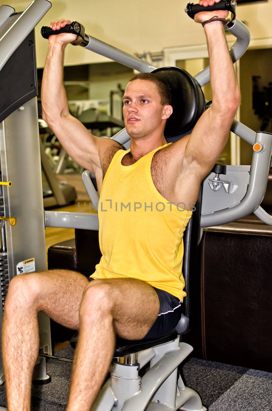 Man doing athlete exercise in fitness club