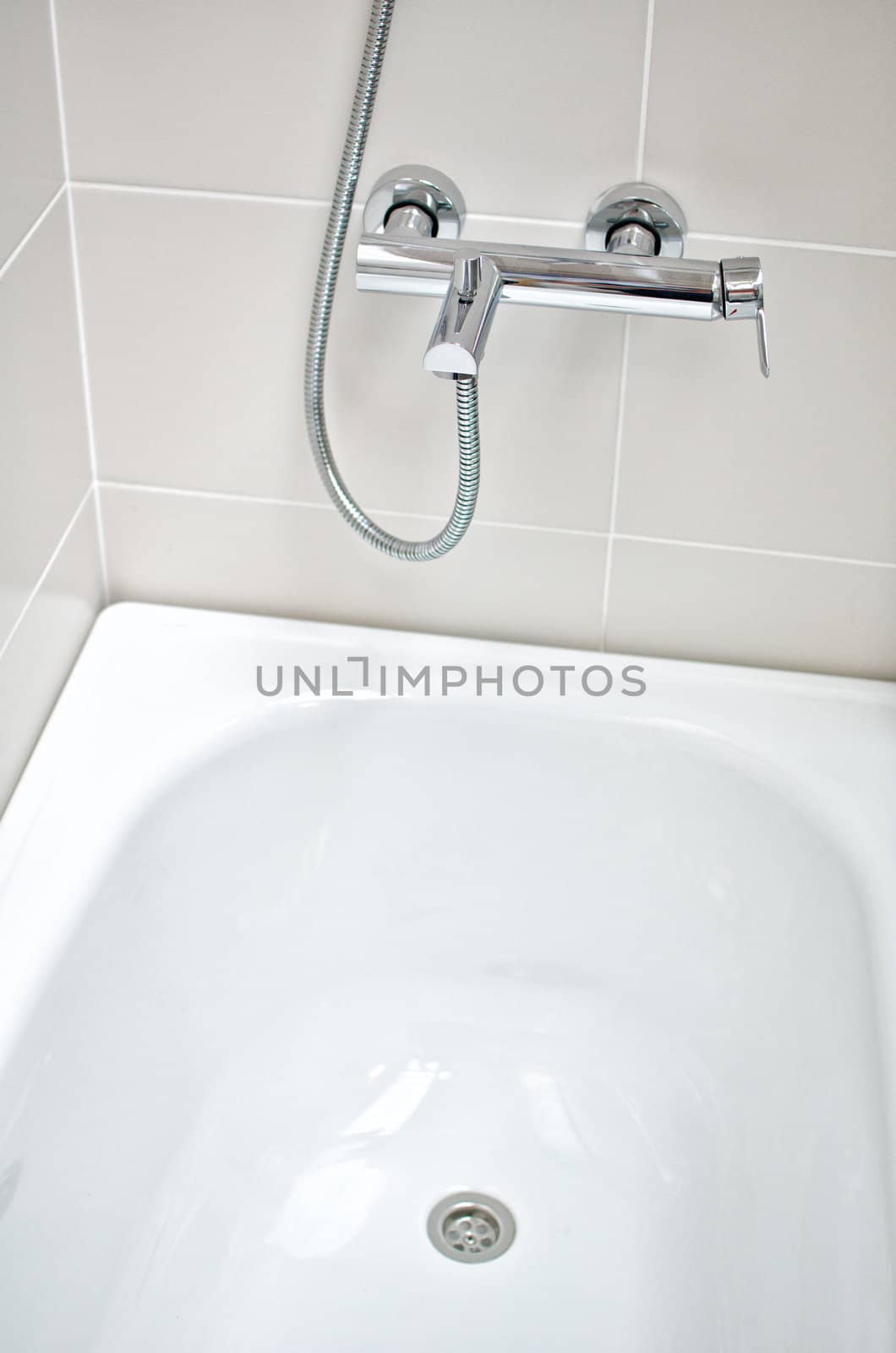 Interior of bathroom with faucet and bathtub