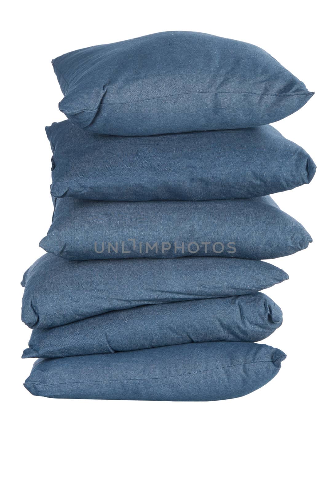 stack of blue denim pillows isolated on white