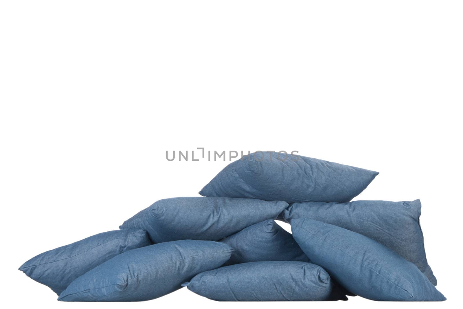 stack of blue denim pillows isolated on white