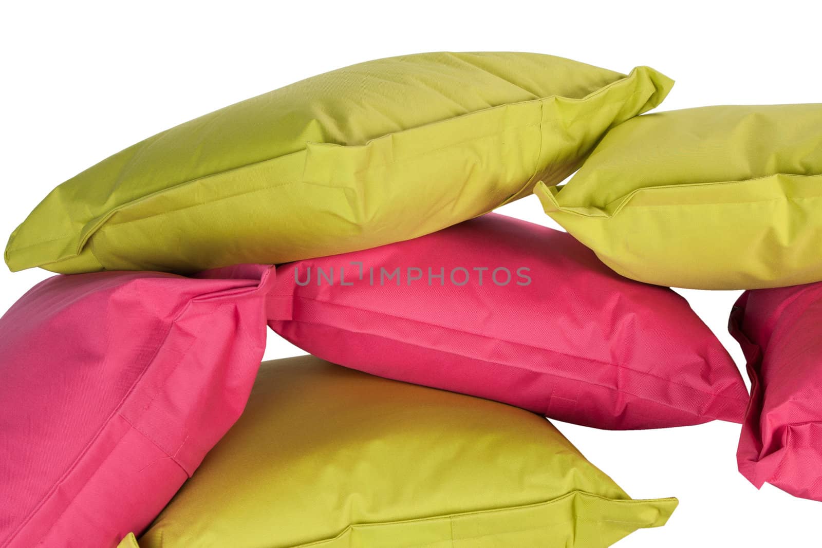 bright stack of pink and green pillows isolated on white