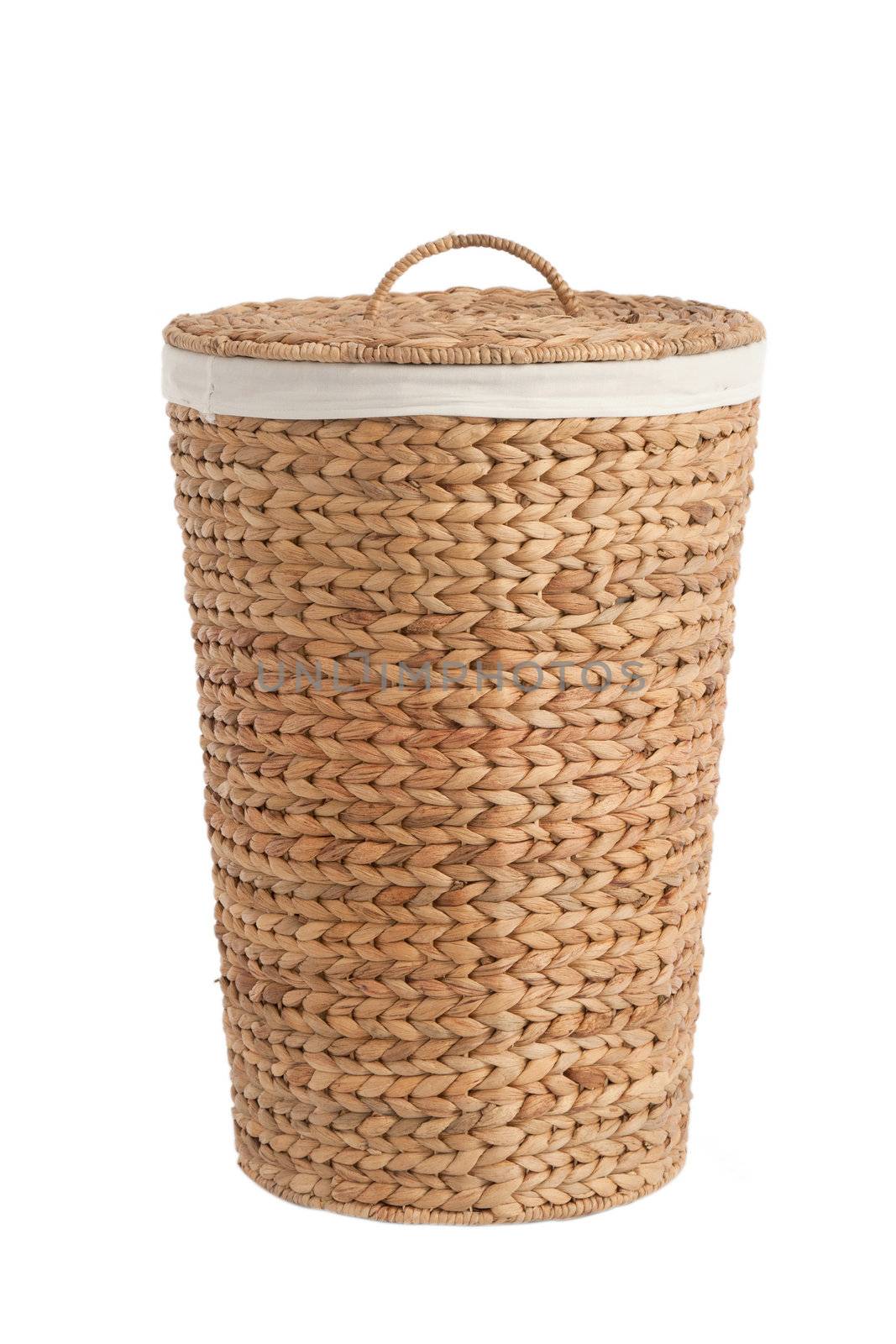 Isolated on white laundry basket made of rattan