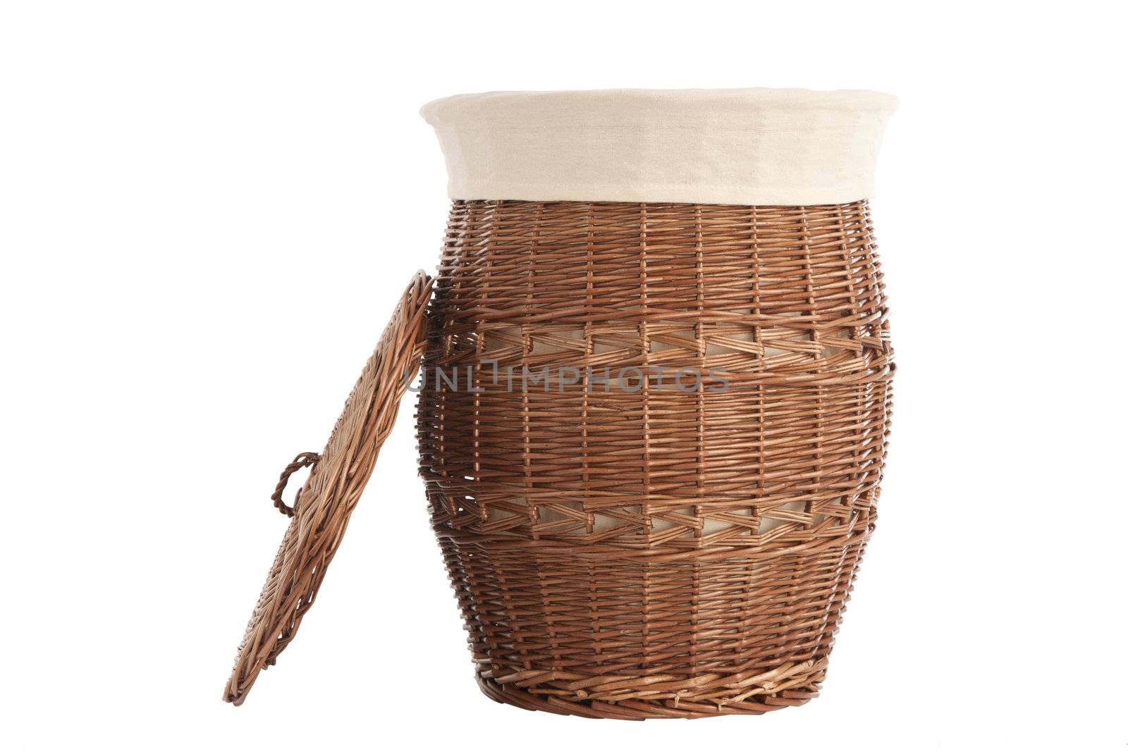 Isolated on white laundry basket made of rattan