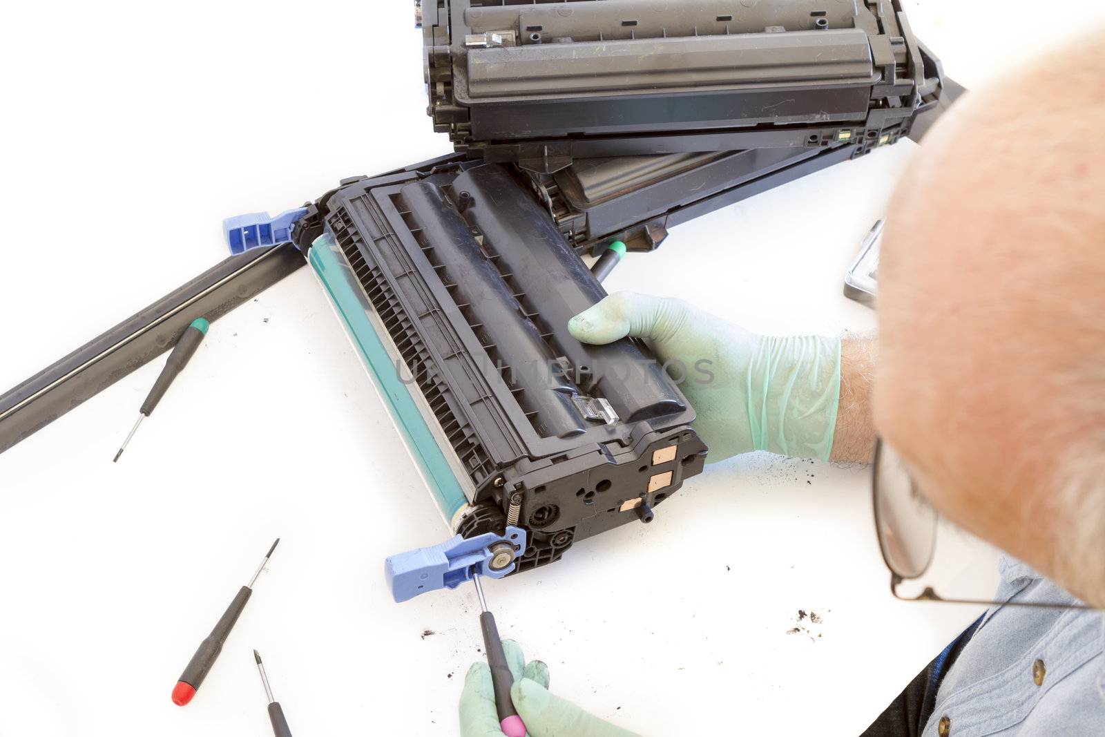 worker Laser printer on a workbench. Printer workshop