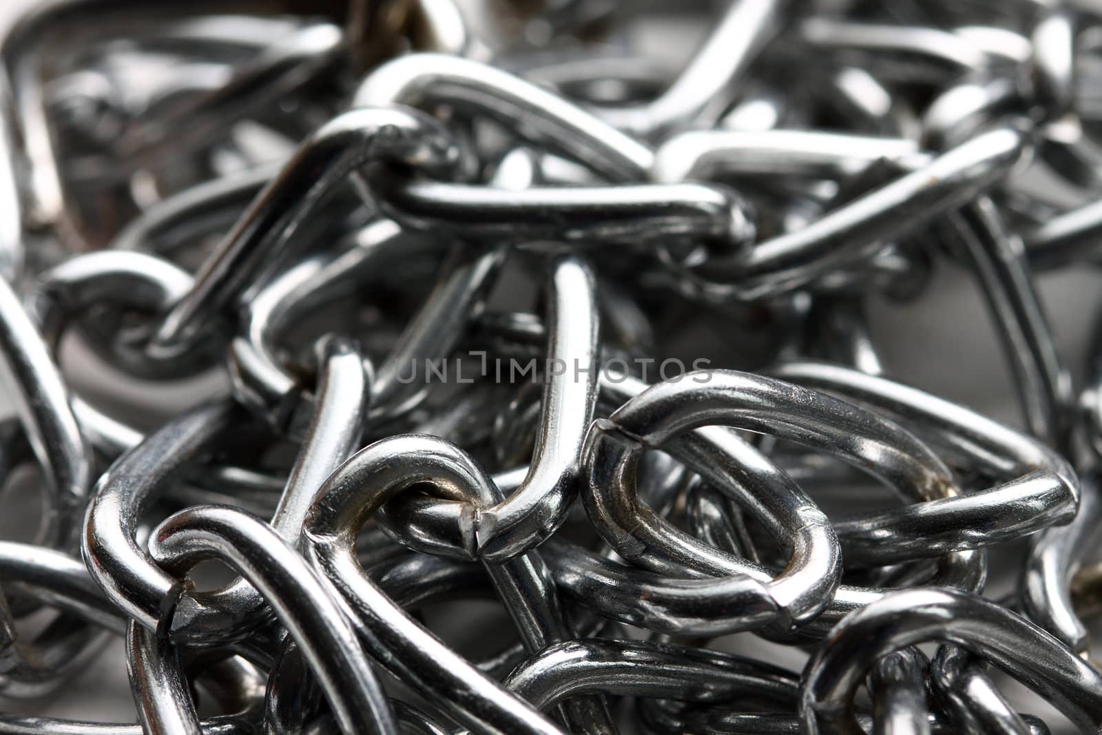 Close up of steel chain links, shallow depth of field