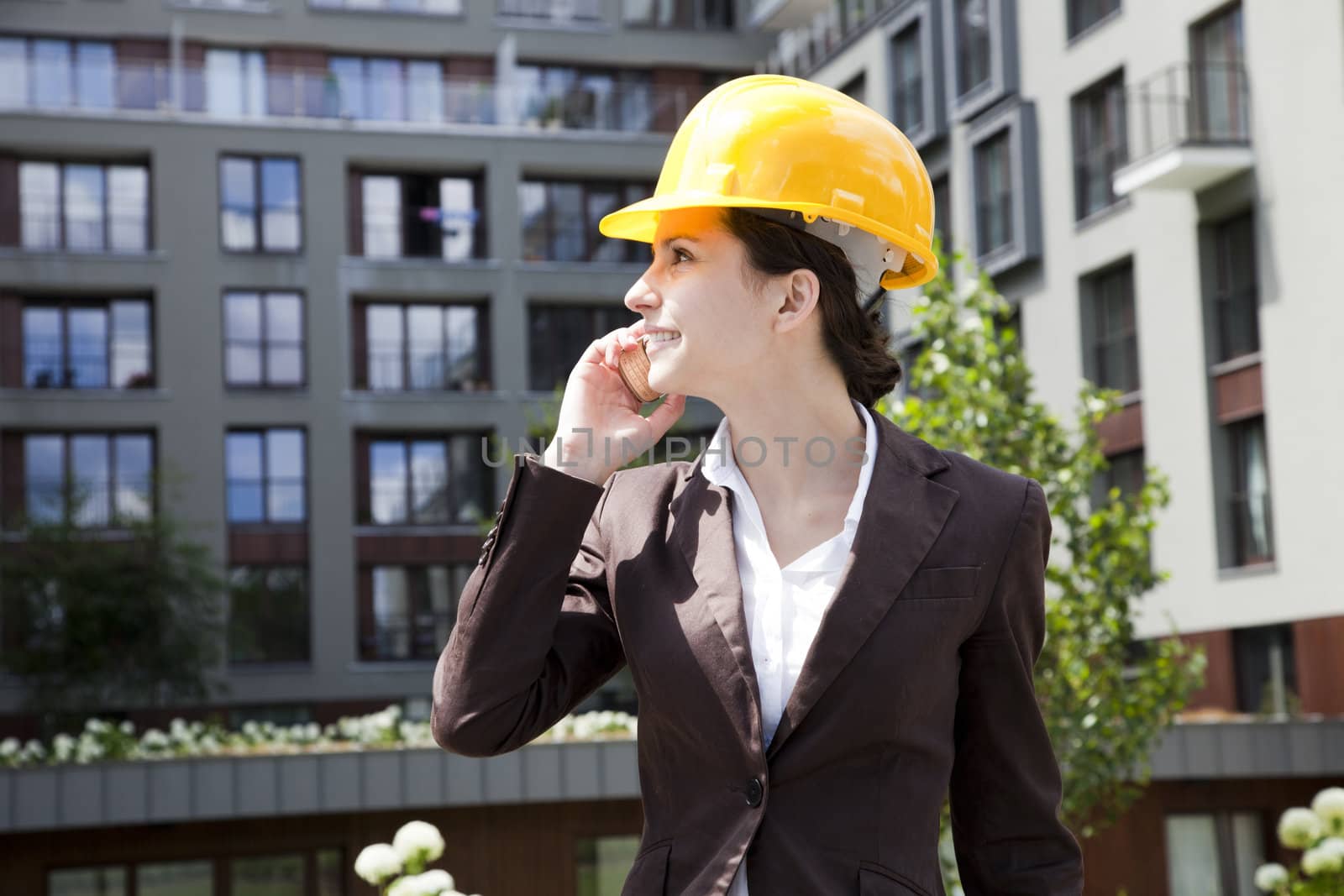 Female construction engineer and yellow helmet