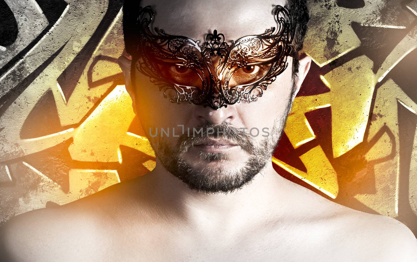 Caucasian men with venetian mask over grafitti background by FernandoCortes