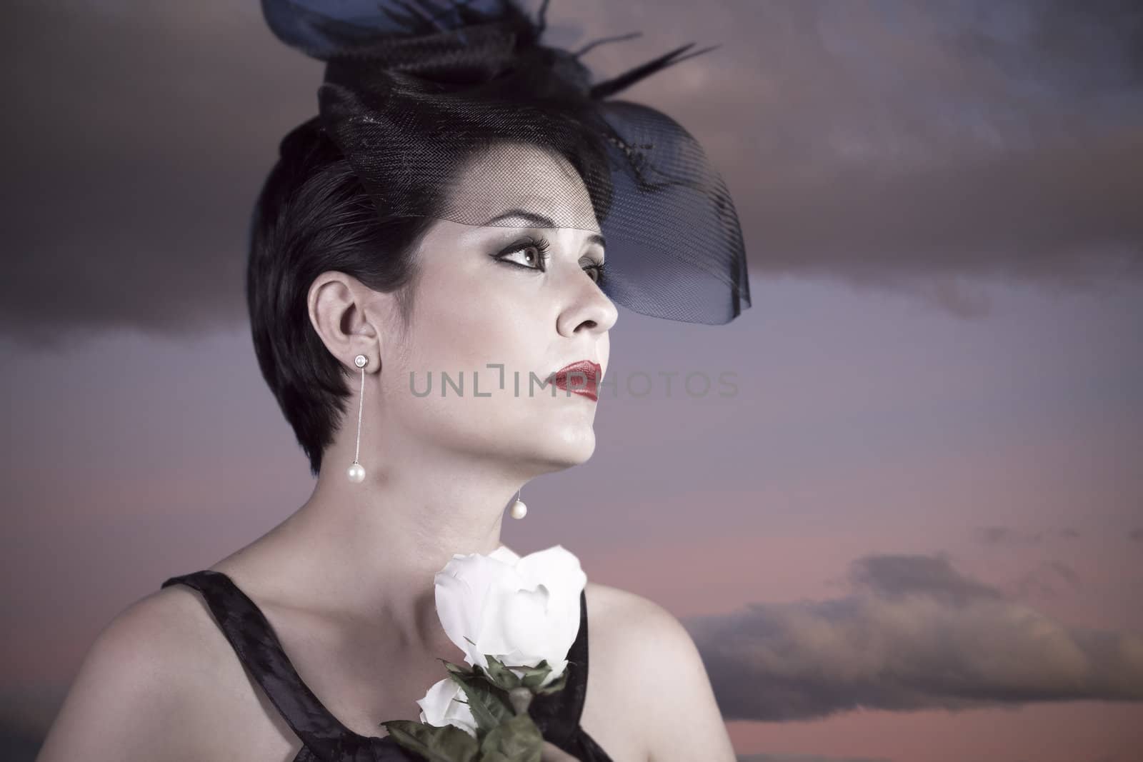 Sad Widow on sunset background, beautiful woman with black veil by FernandoCortes