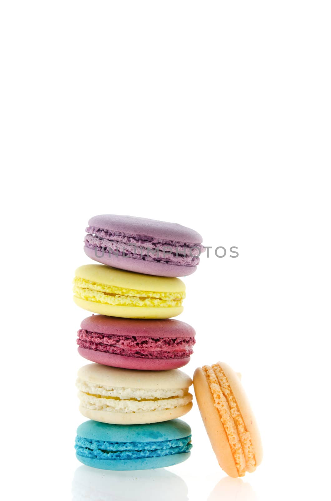 colorful  french macaroons  stack on  white background