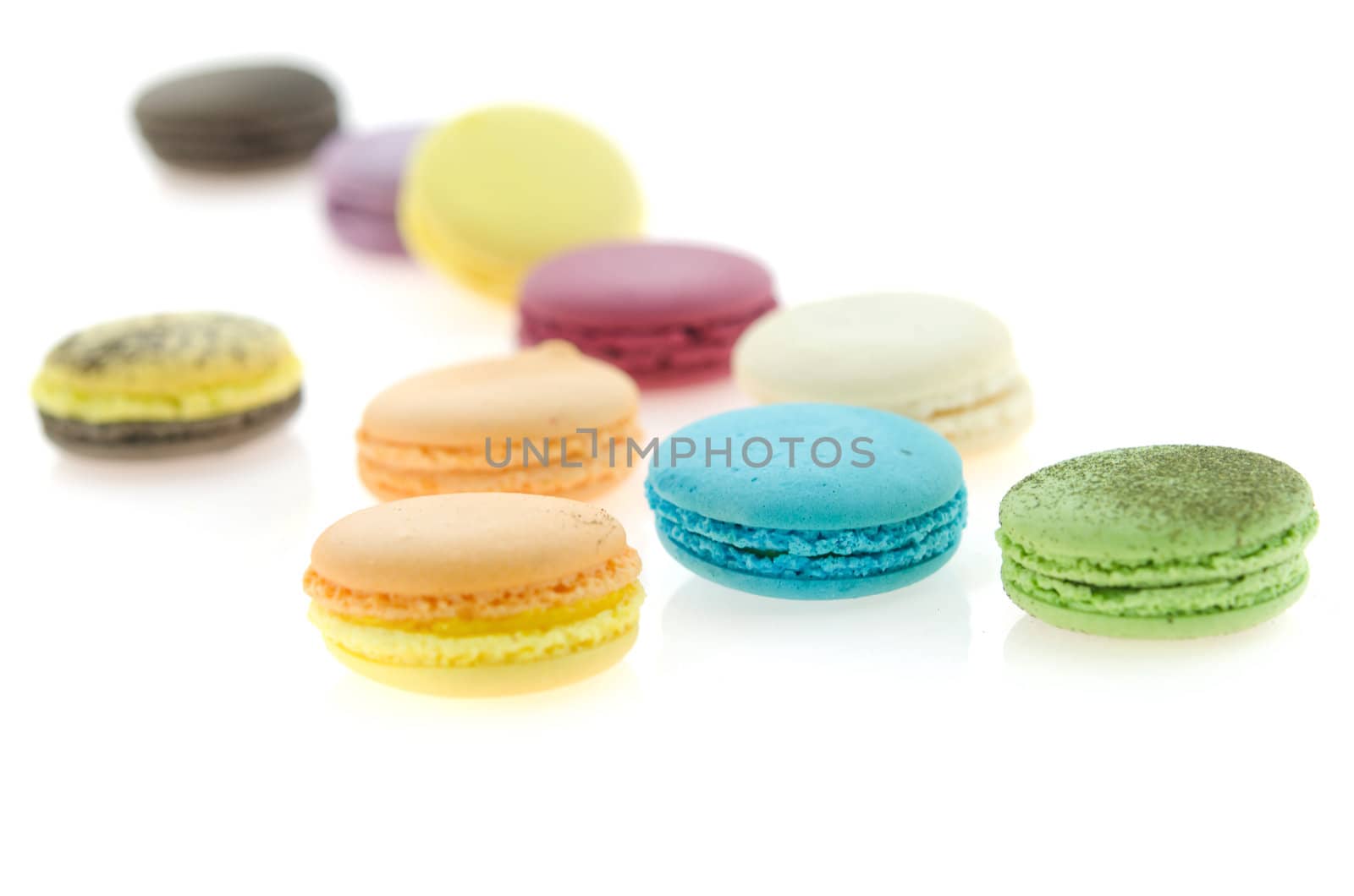 close up colorful  french macaroons on white background