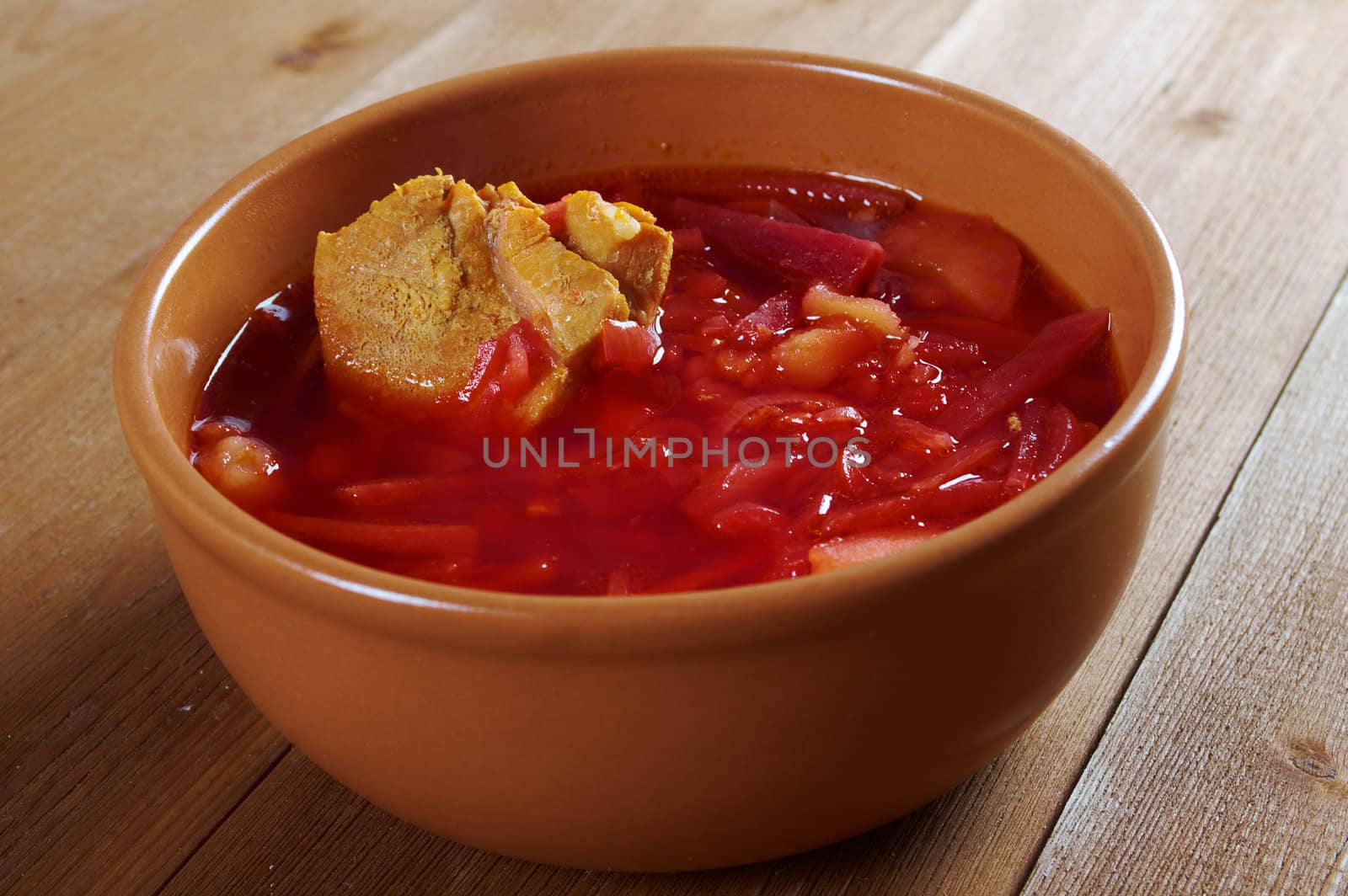 ukrainian and russian red-beet soup (borscht) with garlic and sour cream