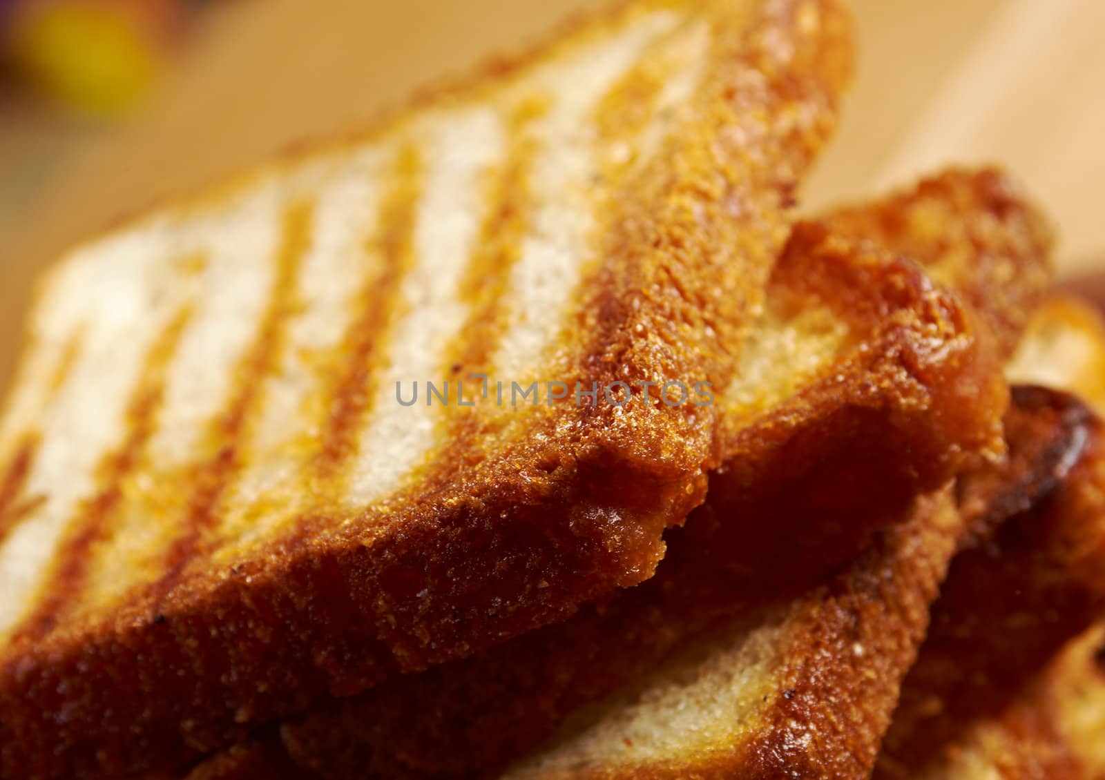 pile  toasted bread slices for breakfast.Close up of toasted white bread in slices