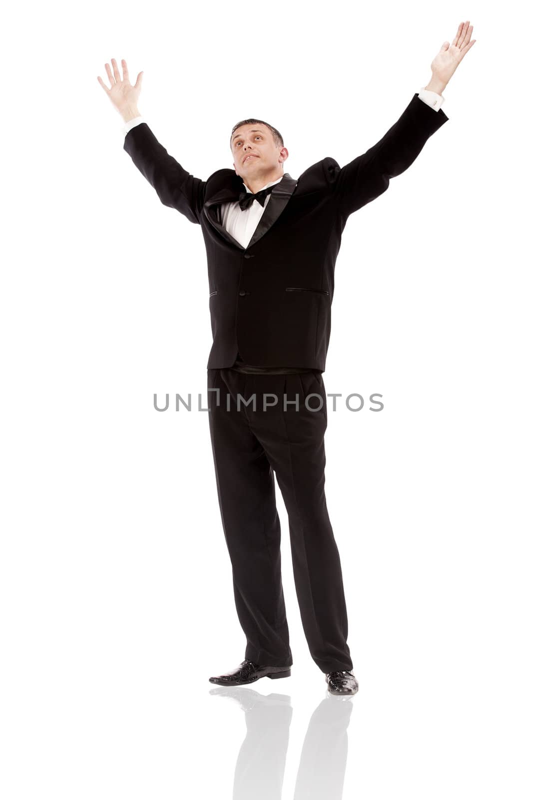 The elegant man in a classical tuxedo on a white background by sergey150770SV