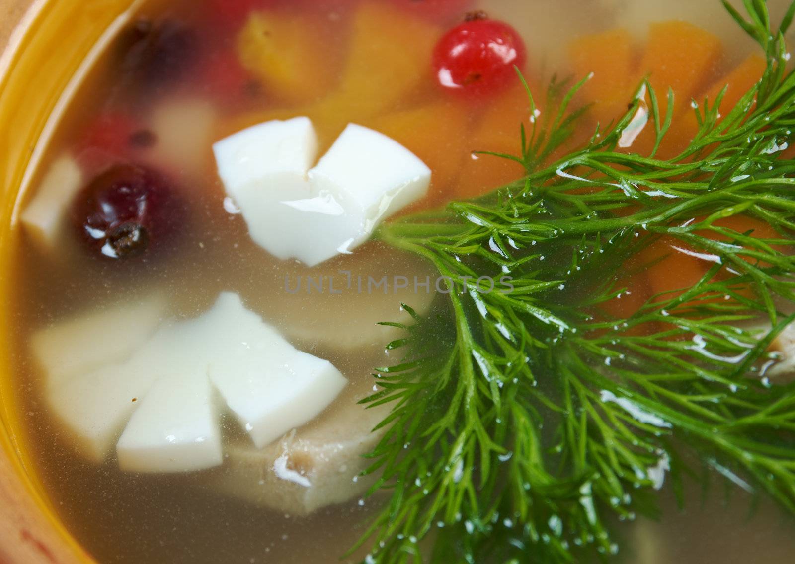 Aspic from meat decorated with egg, carrot,