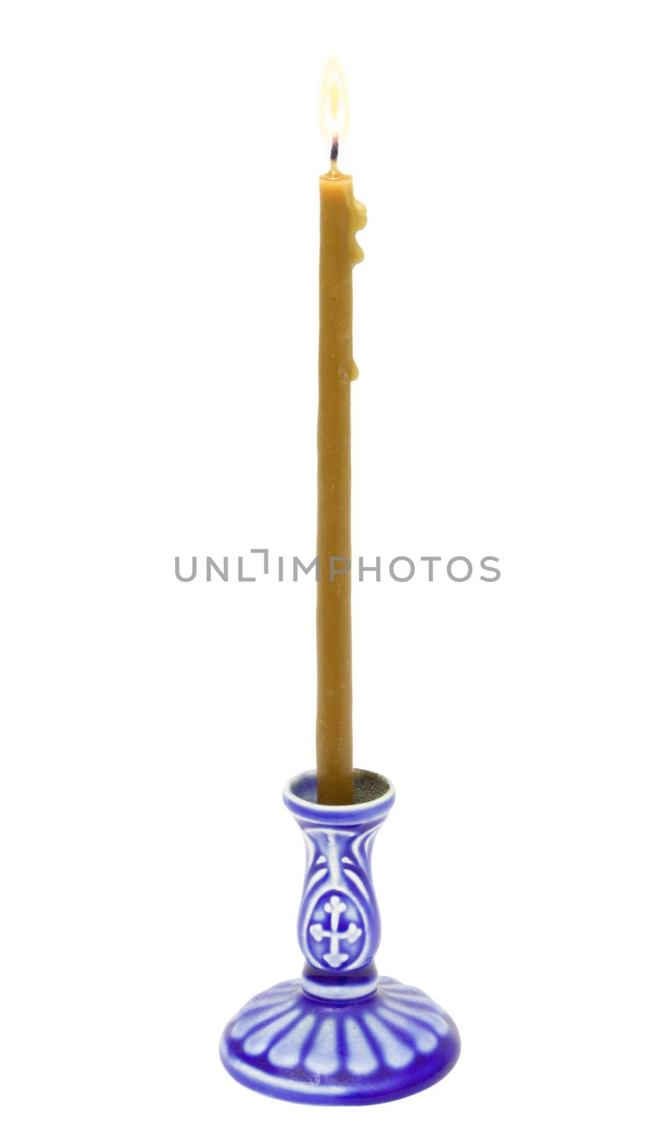 Candle on a dark blue candlestick  isolated on the white