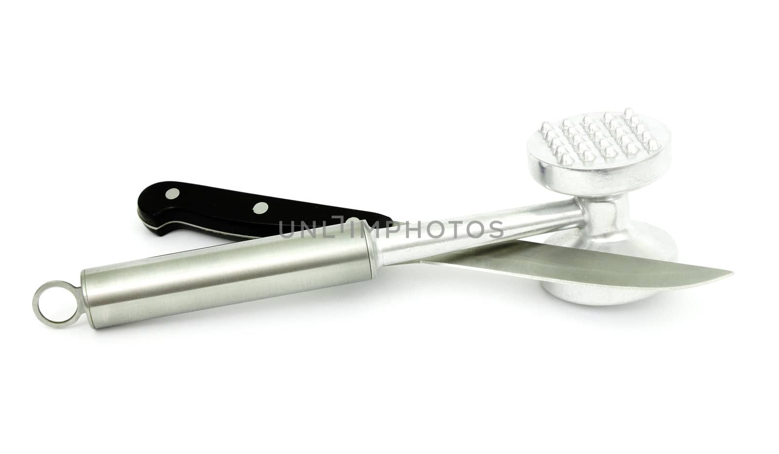 Mallet  beating the meat and a kitchen knife a steel