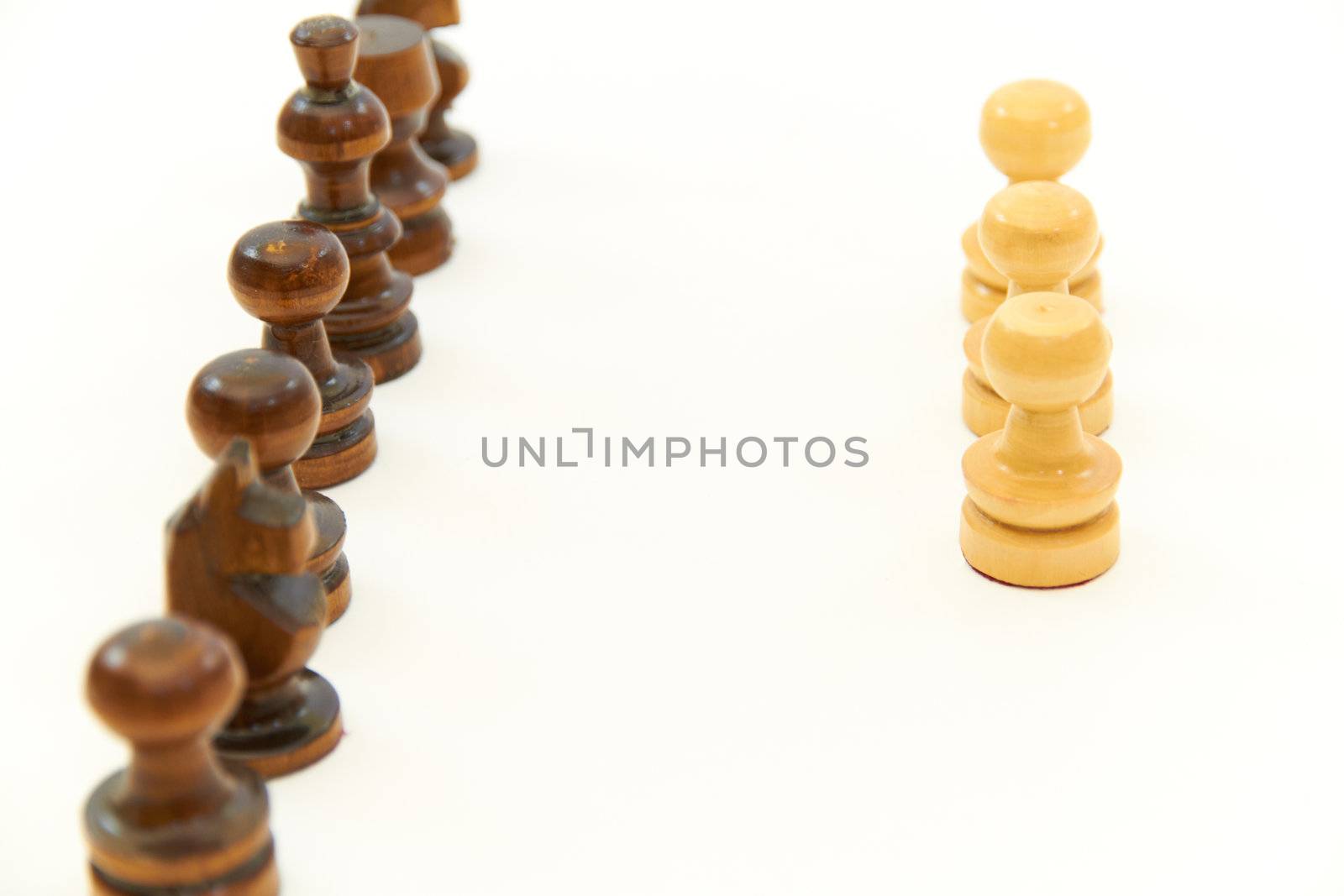 Chess pieces (pawn, knight, king) arranged in an order on white background