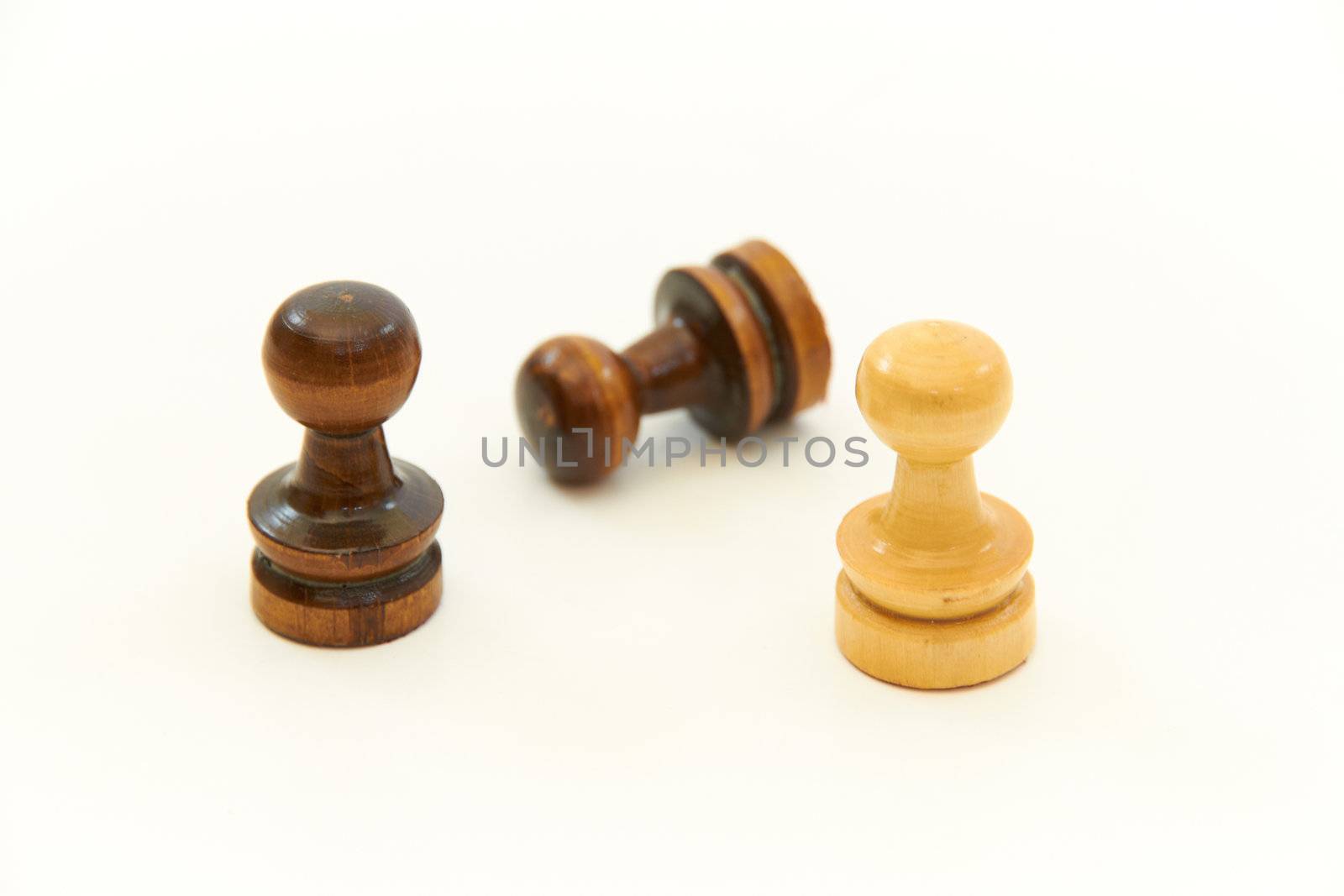 Brown and yellow chess pieces, pawns  on white background