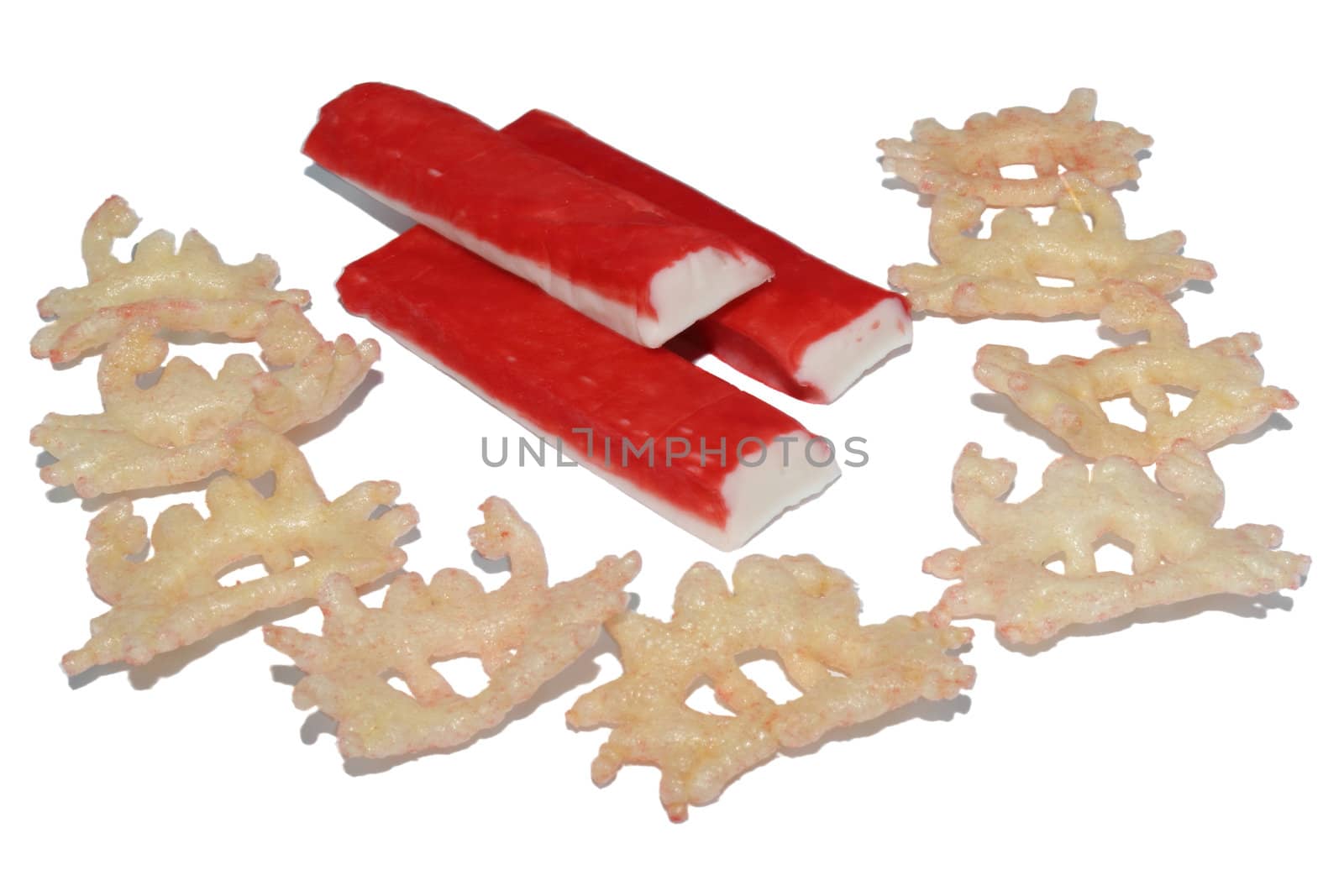 Snacks (chips) with taste of the crab and crab sticks on a white background