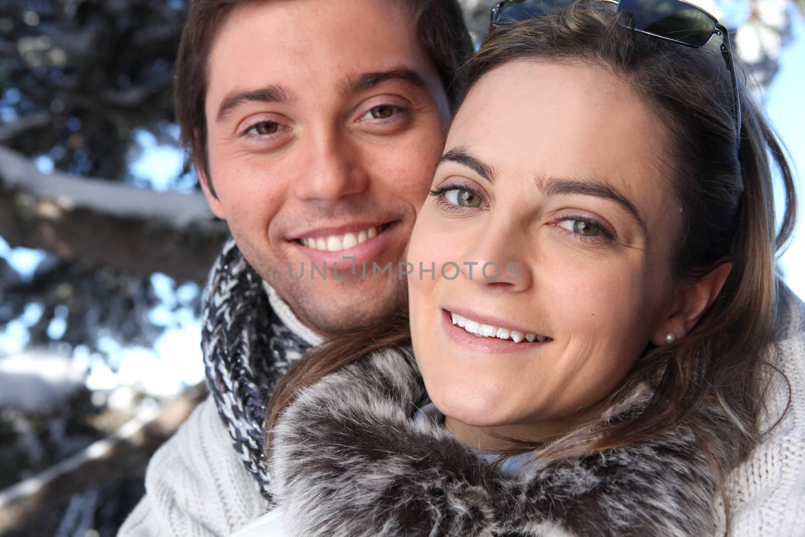 Couple taking a winter walk by phovoir