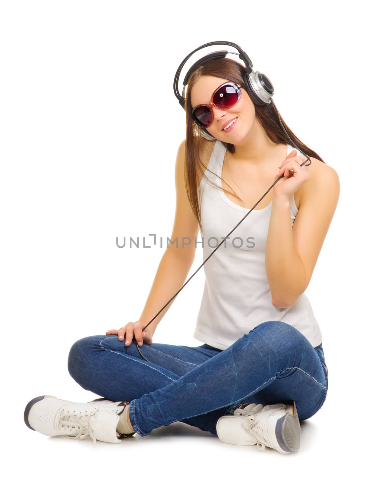 Young girl listen music by headphones isolated