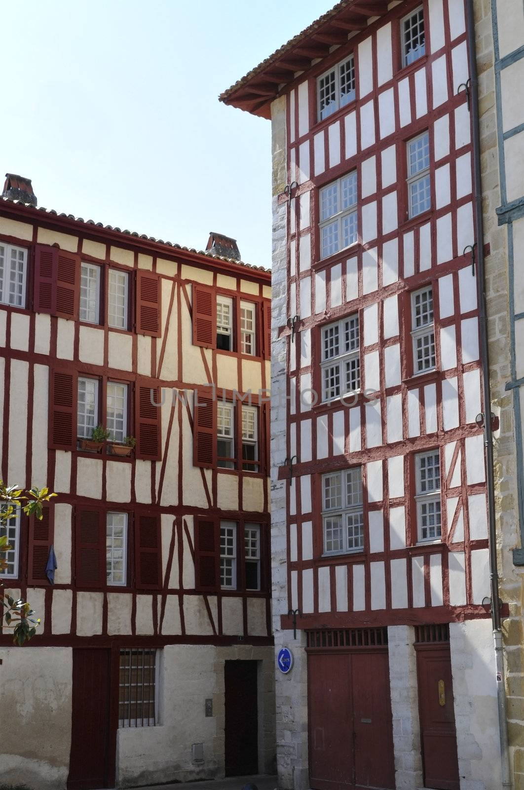 Typical Basque houses in the city of Bayonne with a blue sky