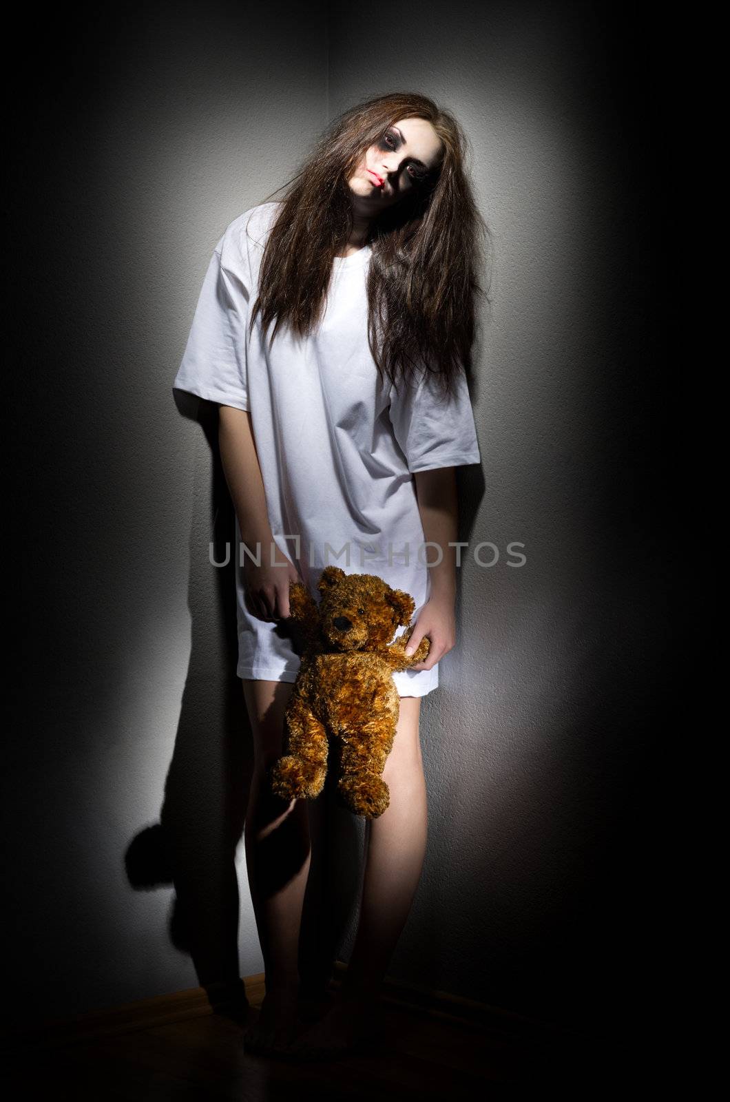 Zombie girl with plush teddy bear