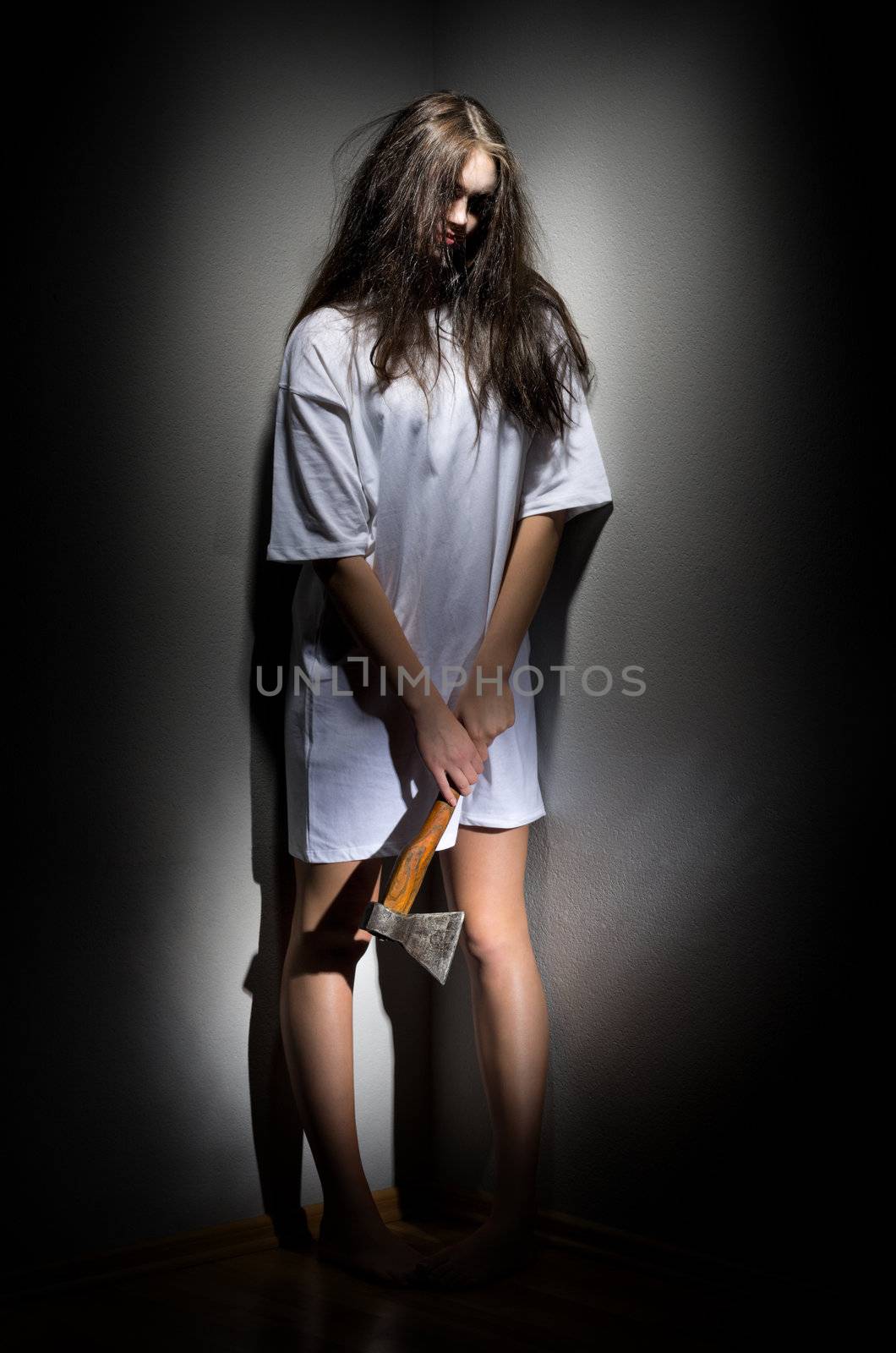 Young zombie girl with axe