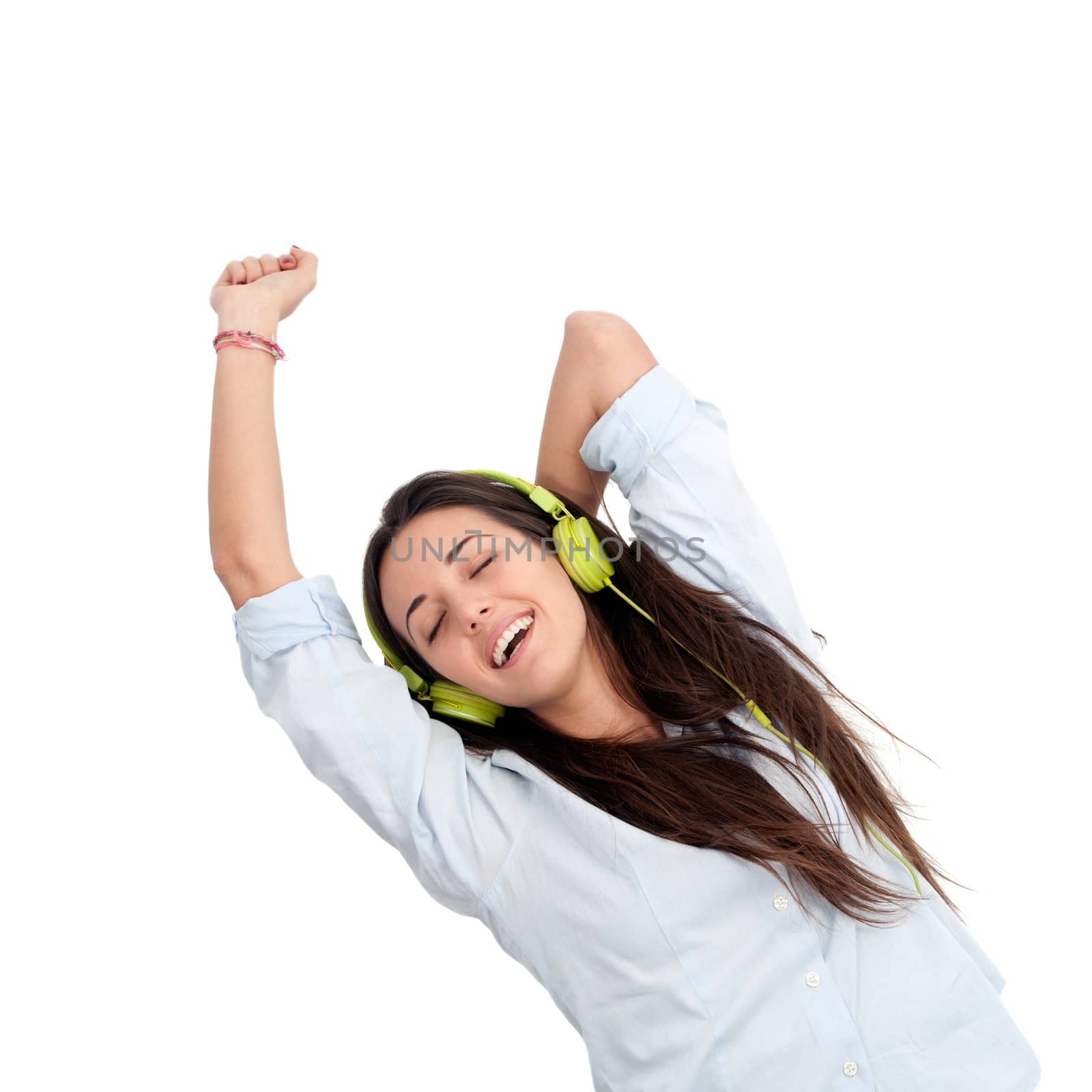 Girl dancing to the beat with headphones.Isolated.