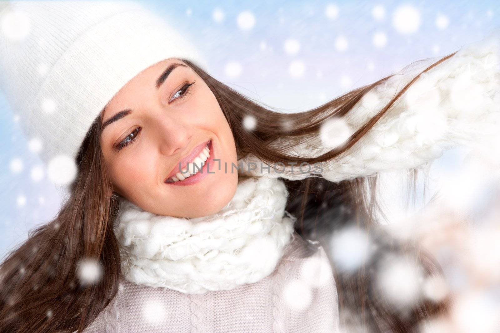 Close up of attractive winter girl with snowflakes.
