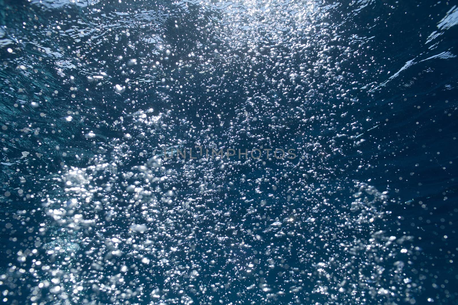 background of sunlight bubbles in deep water