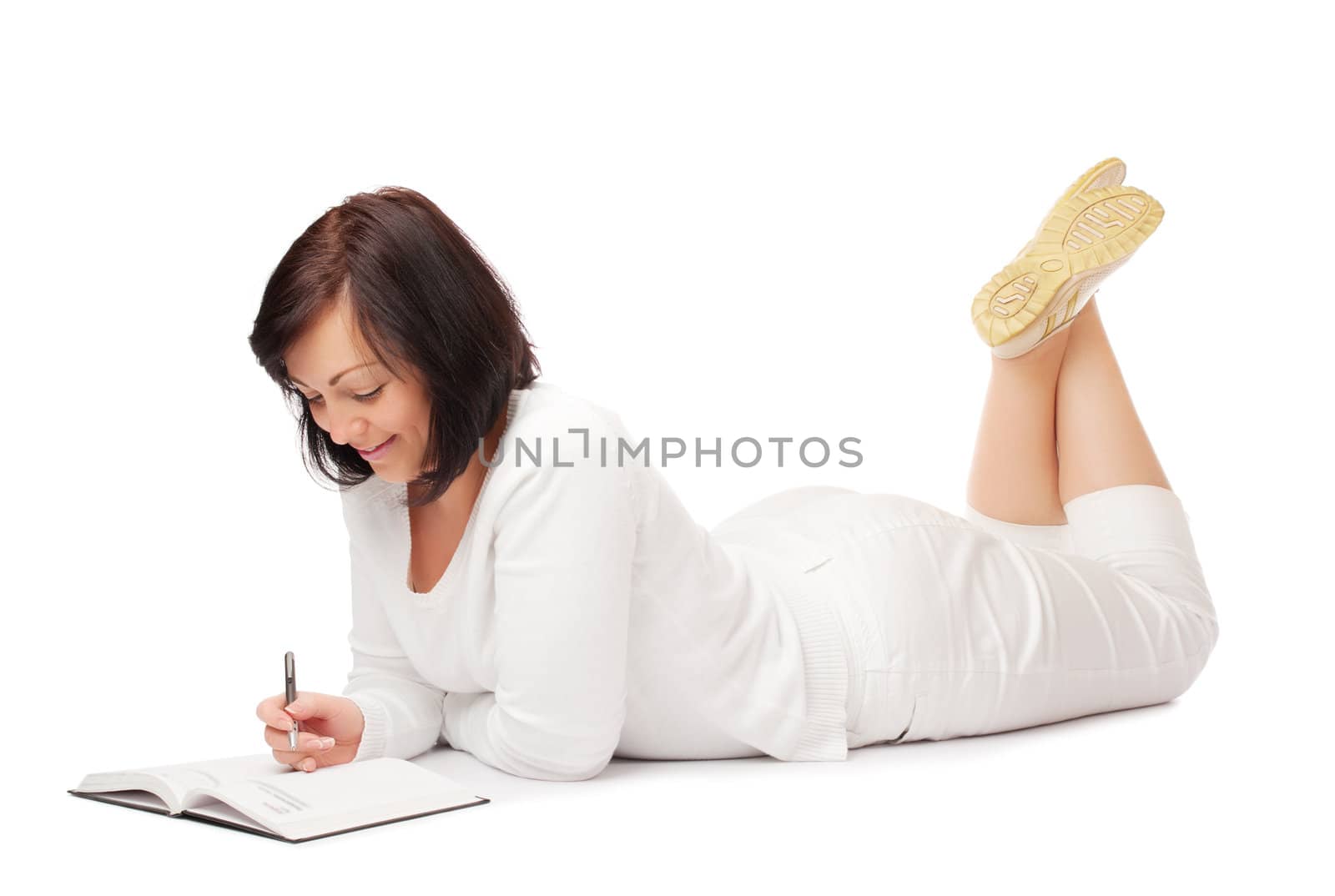 Young smiling woman with book and pen isolated