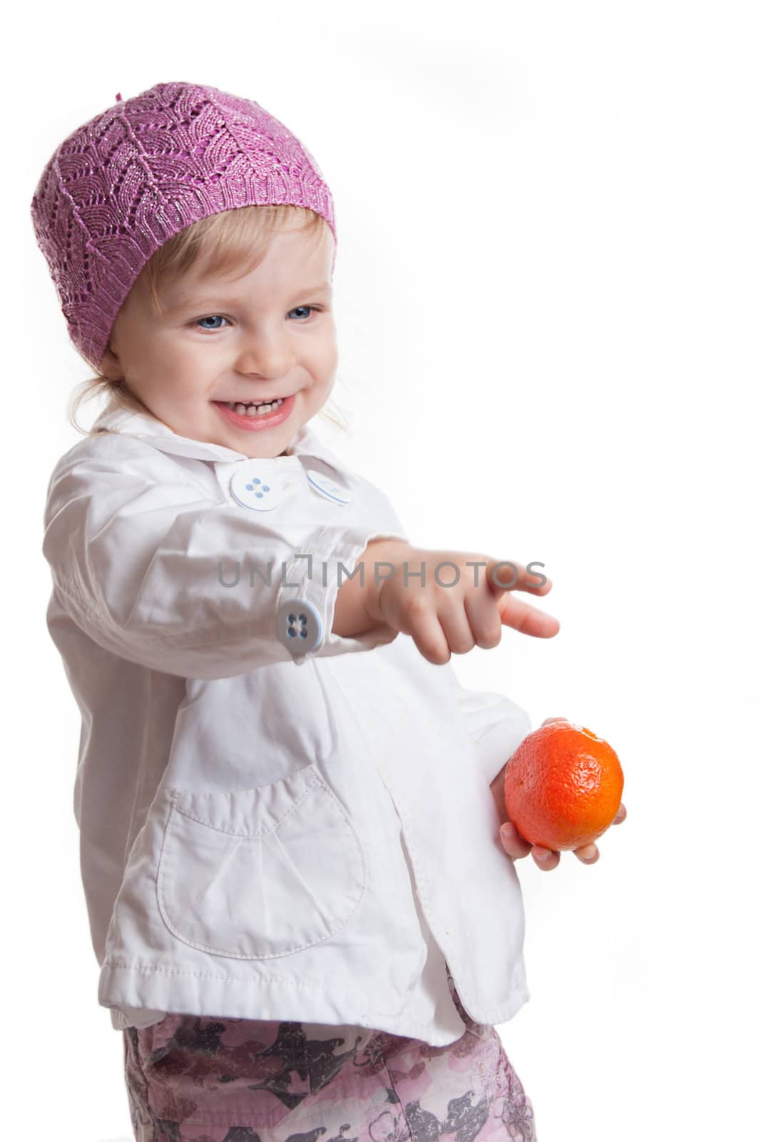 Smiling girl pointing at something isolated on white, focus on eyes