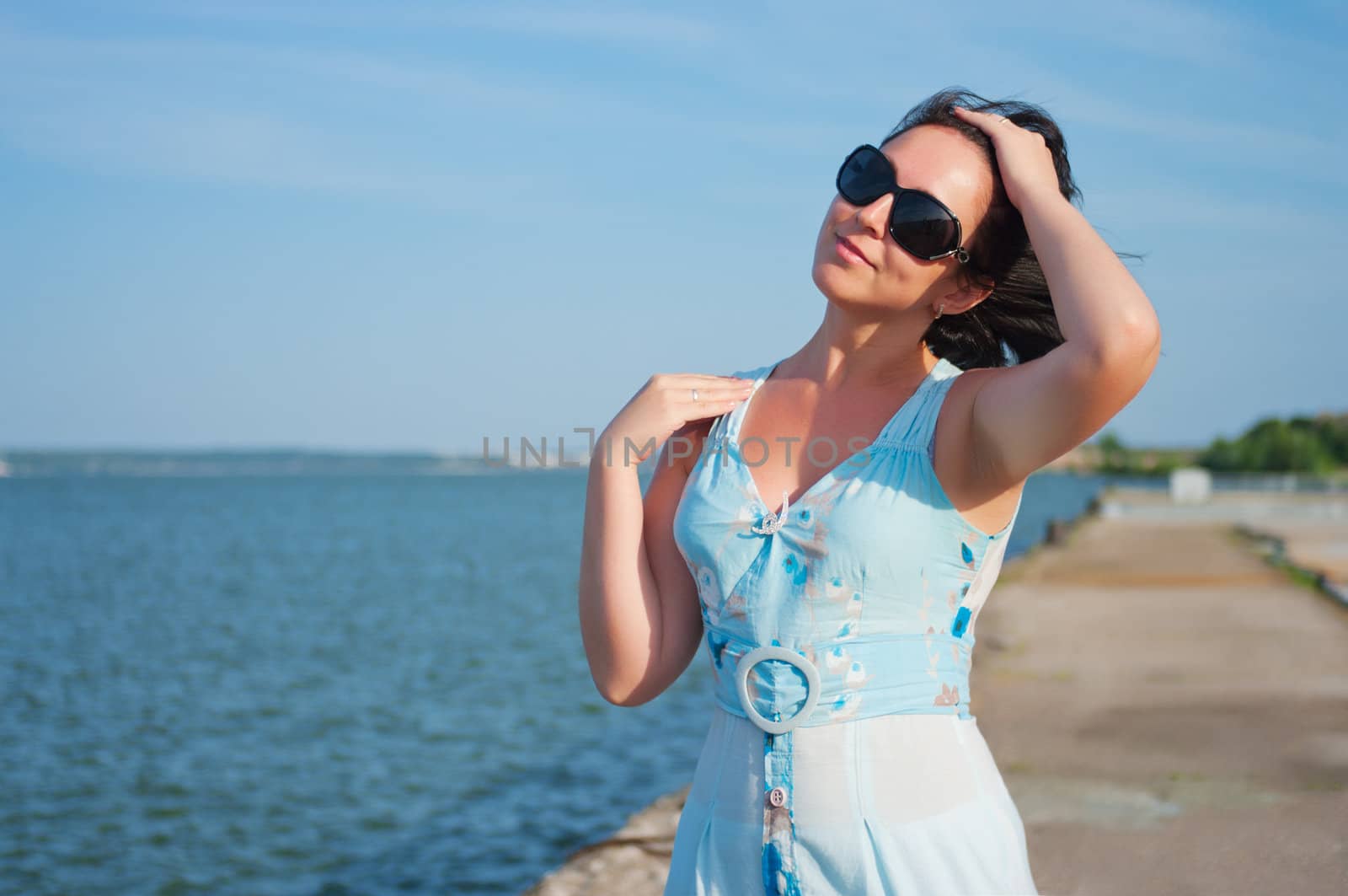 Young smiling woman on quay