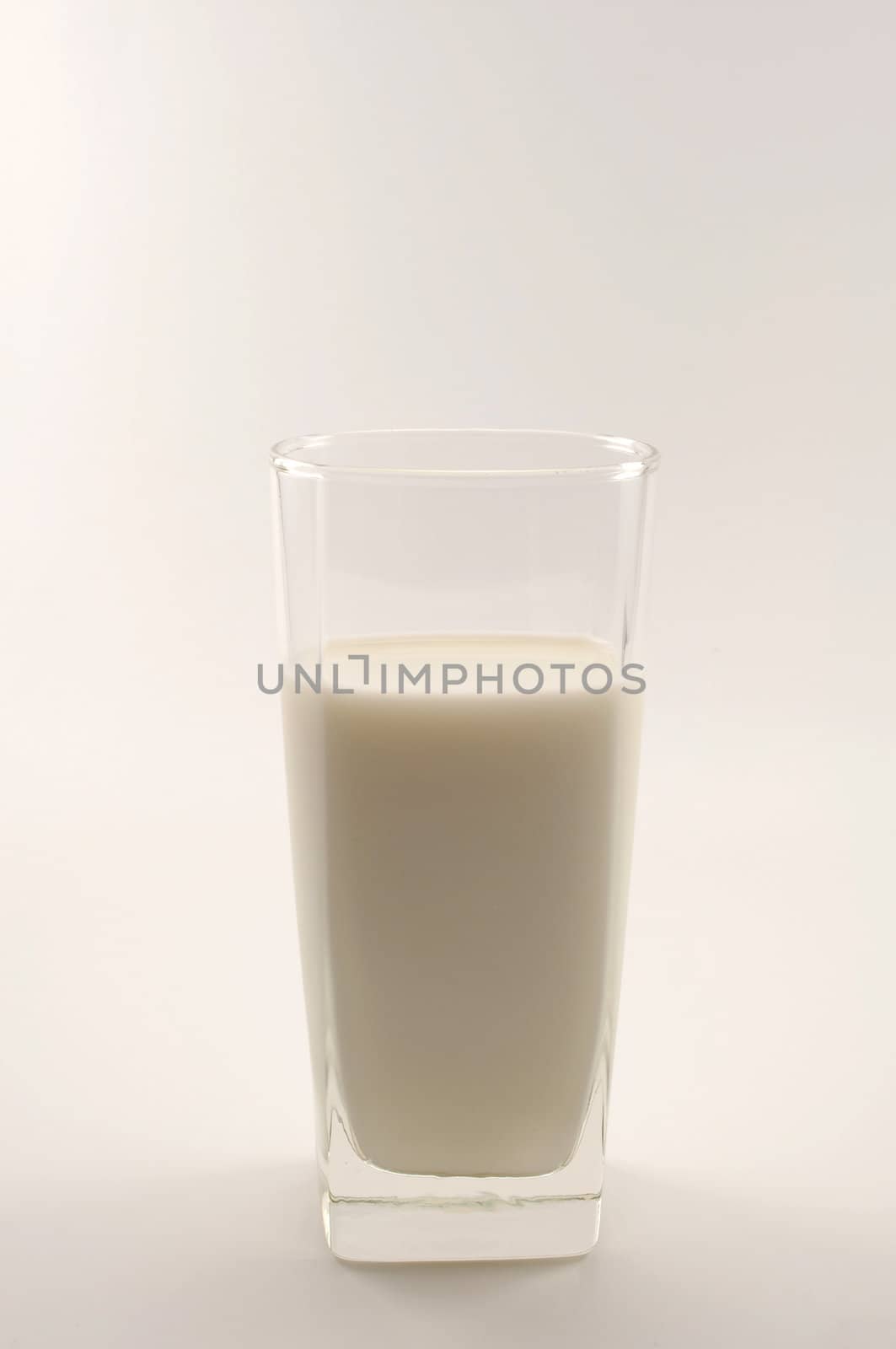 glass of milk on white background