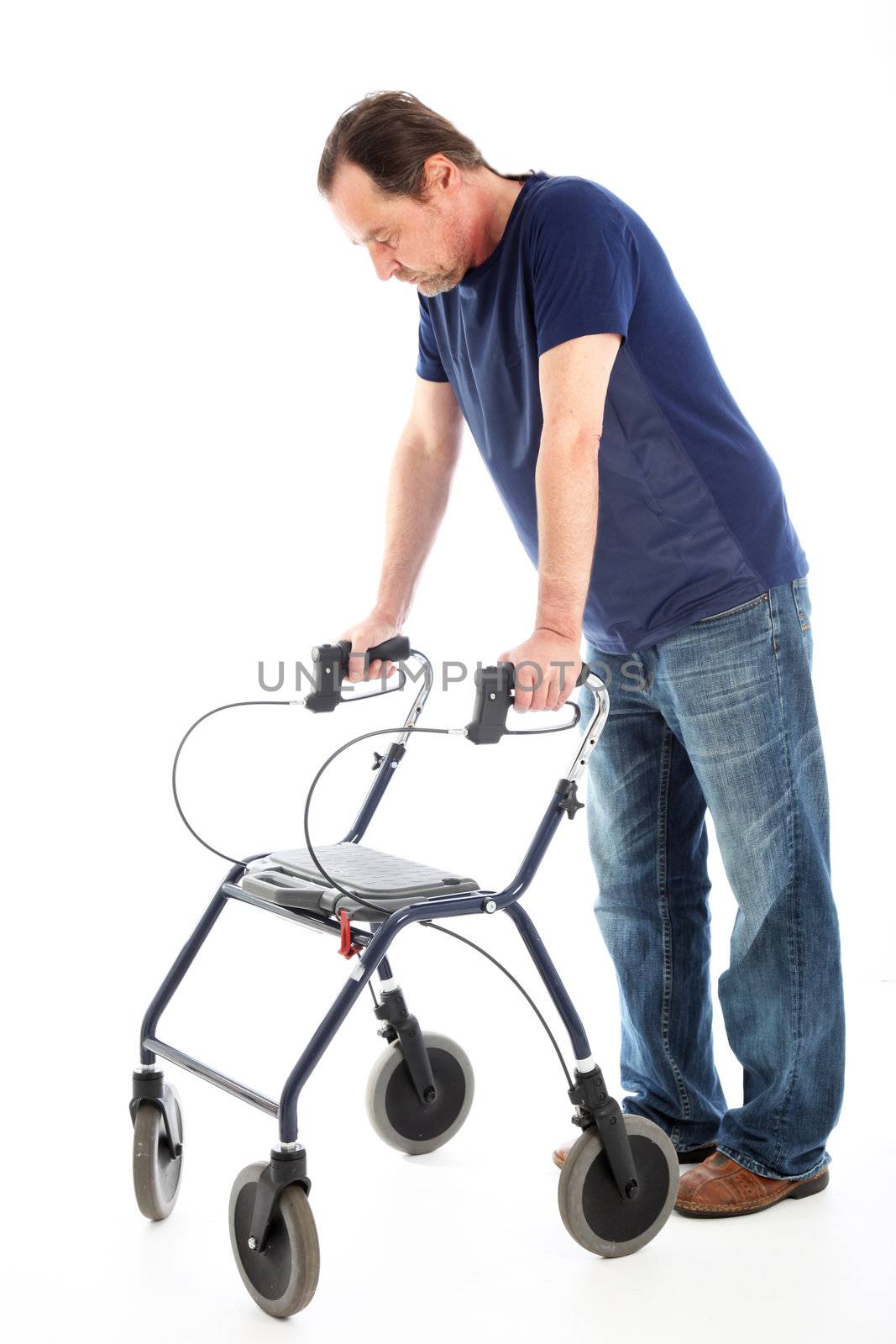 Despondent man facing the camera leaning on a medical walker for support isolated on whiteondent man on medical walker 