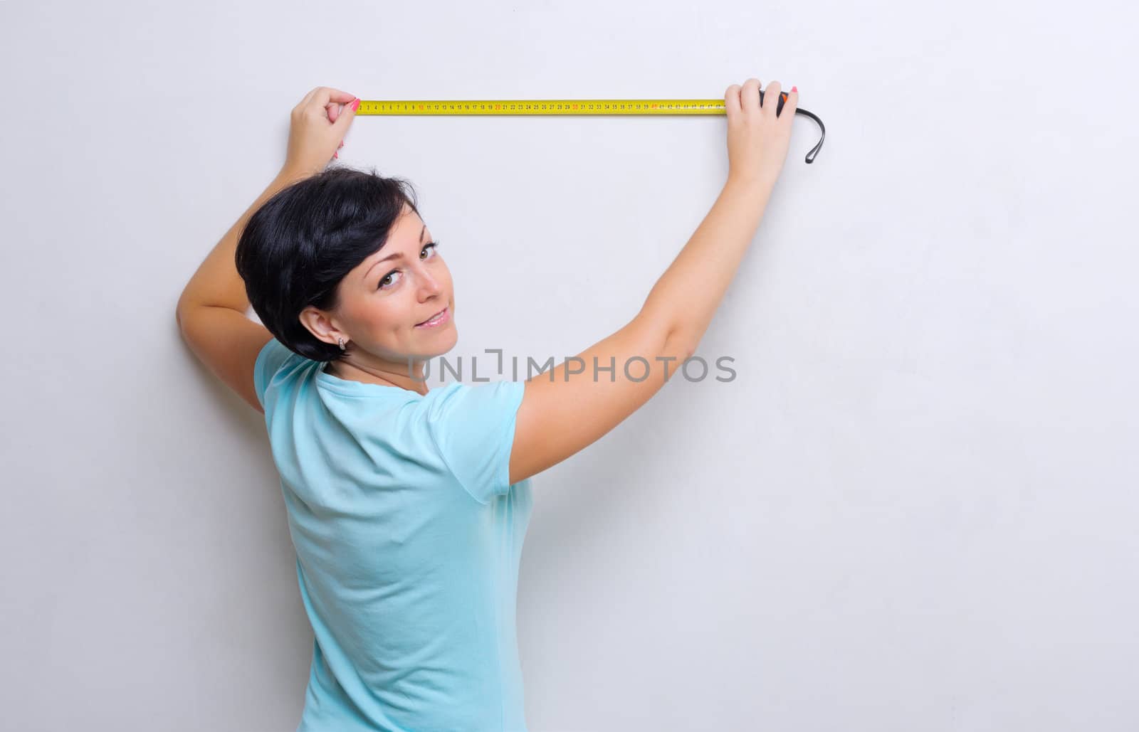 Woman with measurement tape by rbv